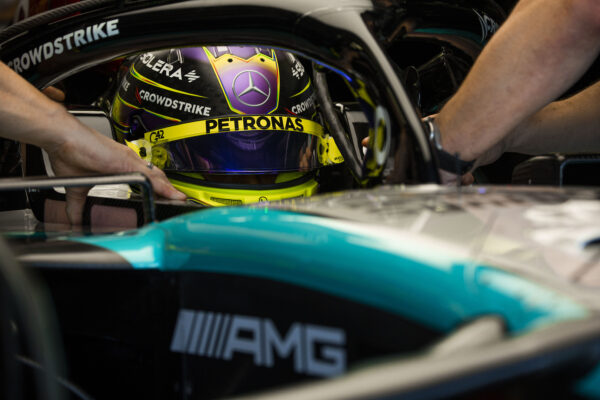 Lewis Hamilton sitting in his Mercedes F1 car
