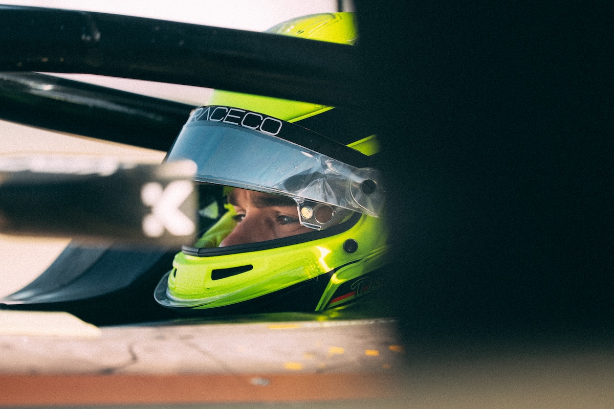 David Beckman with his helmet on, in his Cupra Kiro car.