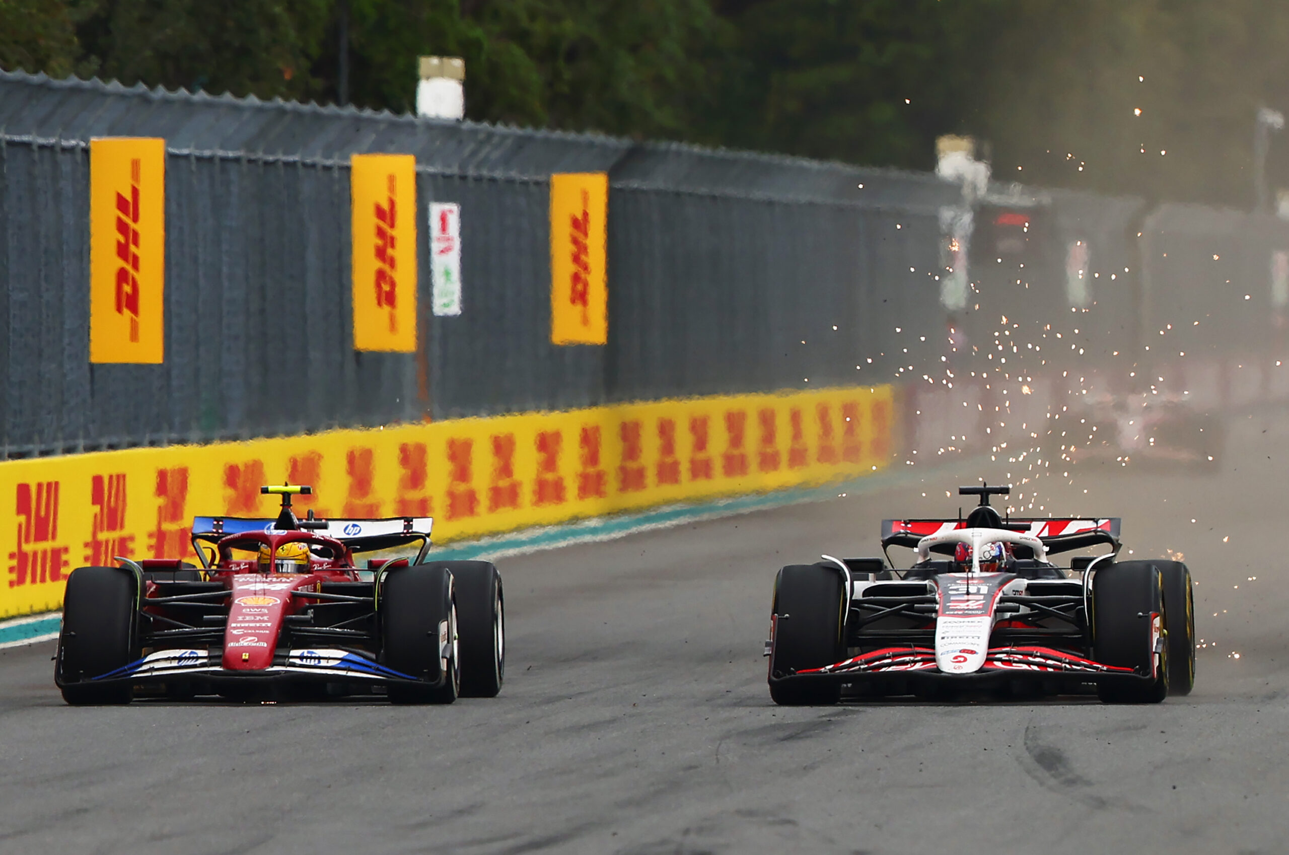 Esteban Ocon for Haas fighting Hamilton in the Ferrari in the Miami GP