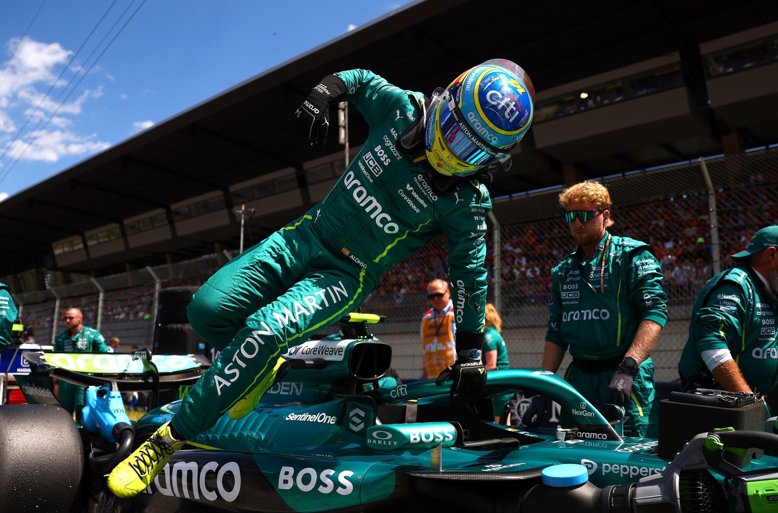 Aston Martin driver, Fernando Alonso, getting out of his car after his P7 finish in the F1 Austrian GP