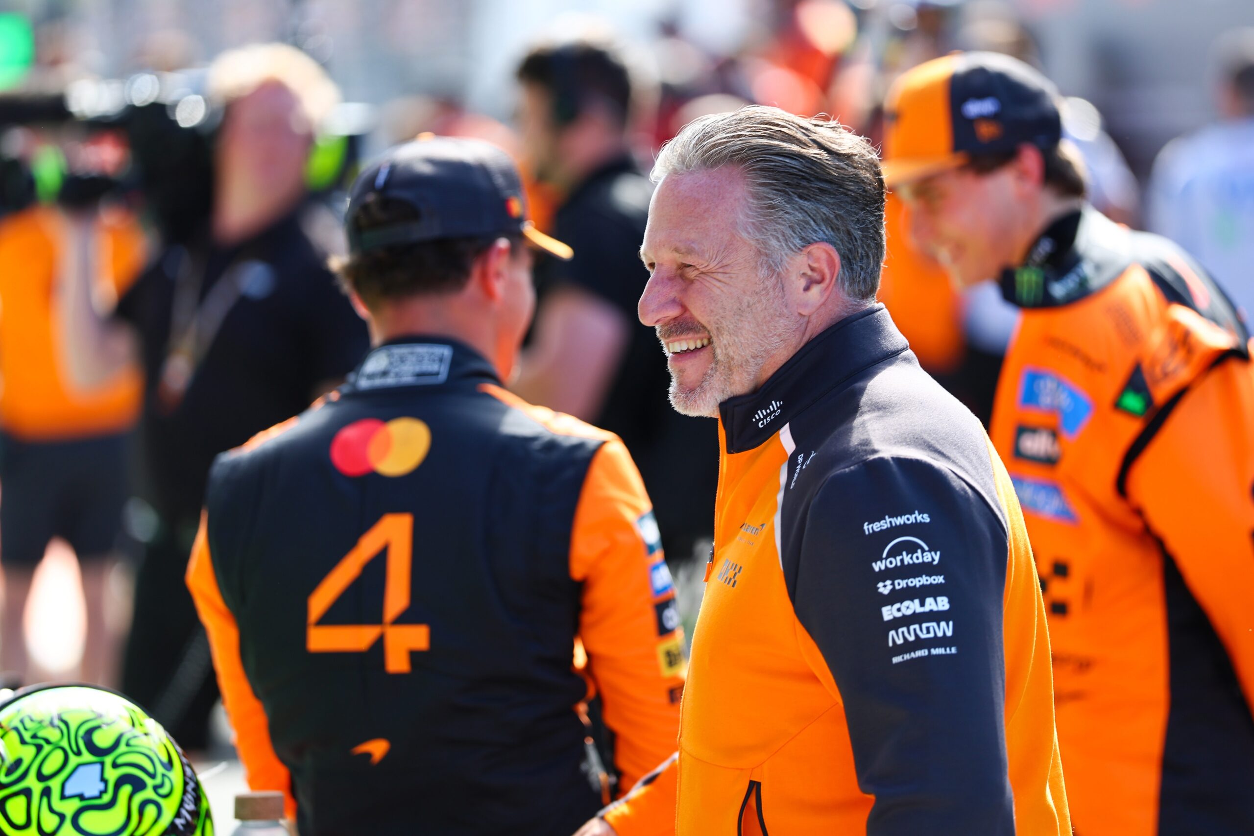 McLaren F1 CEO Zak Brown smiling trackside