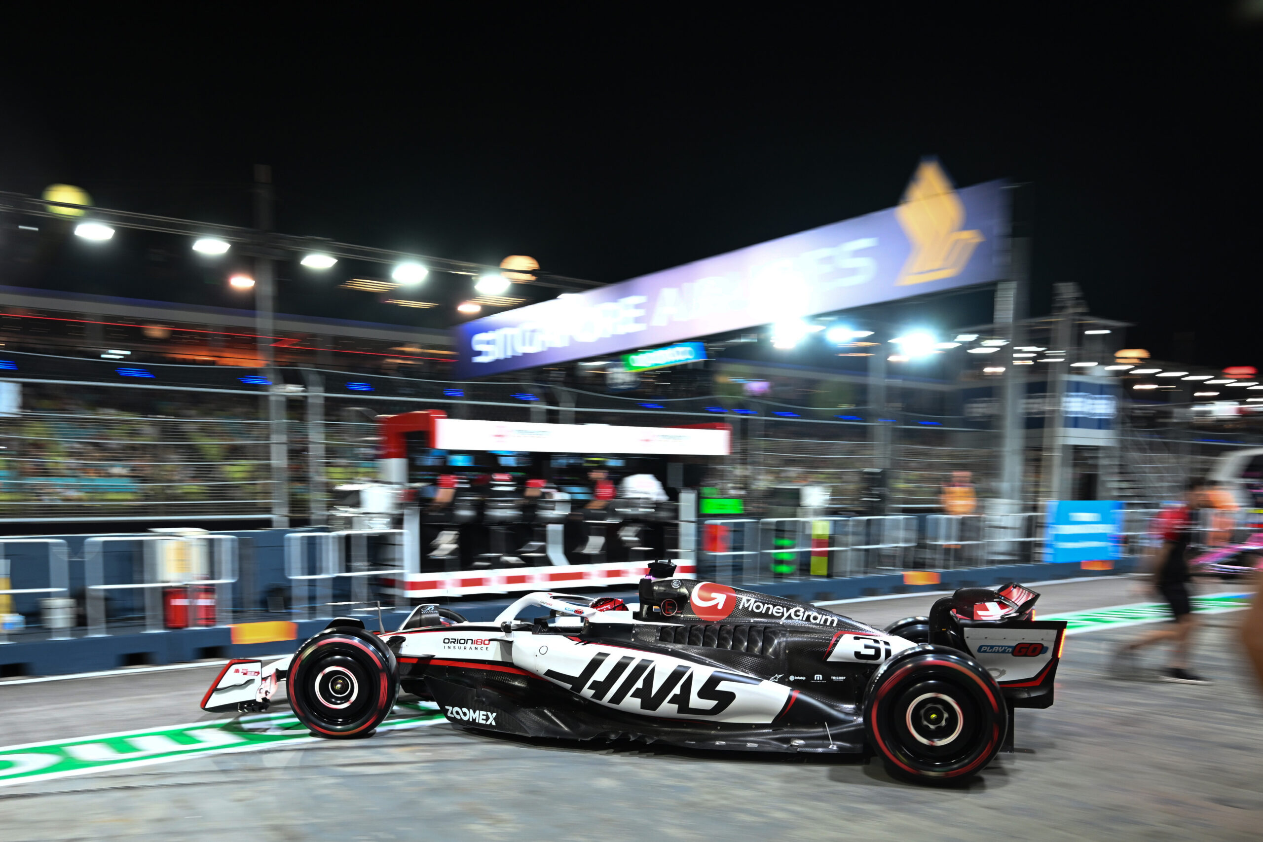 SINGAPORE, SINGAPORE - OCTOBER 03: Esteban Ocon of France driving the (31) Haas F1 VF-25 Ferrari leaves the garage during practice ahead of the F1 Grand Prix of Singapore at Marina Bay Street Circuit on October 03, 2025 in Singapore, Singapore. (Photo by Simon Galloway/LAT Images)