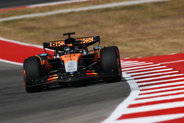 Oscar Piastri in McLaren in front of the Circuit of the Americas backdrop during the US Sprint Qualifying.