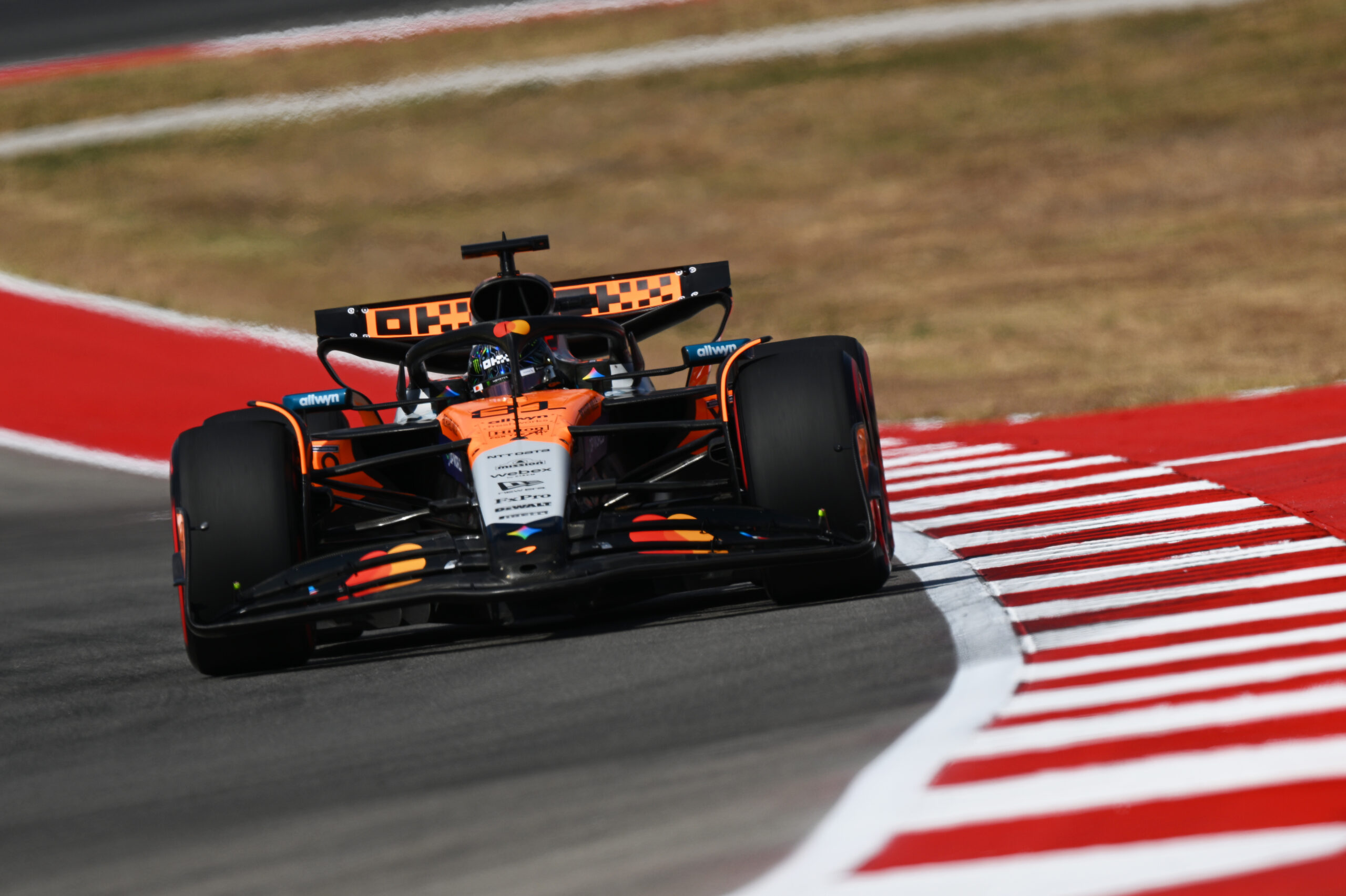 Oscar Piastri in McLaren in front of the Circuit of the Americas backdrop during the US Sprint Qualifying.