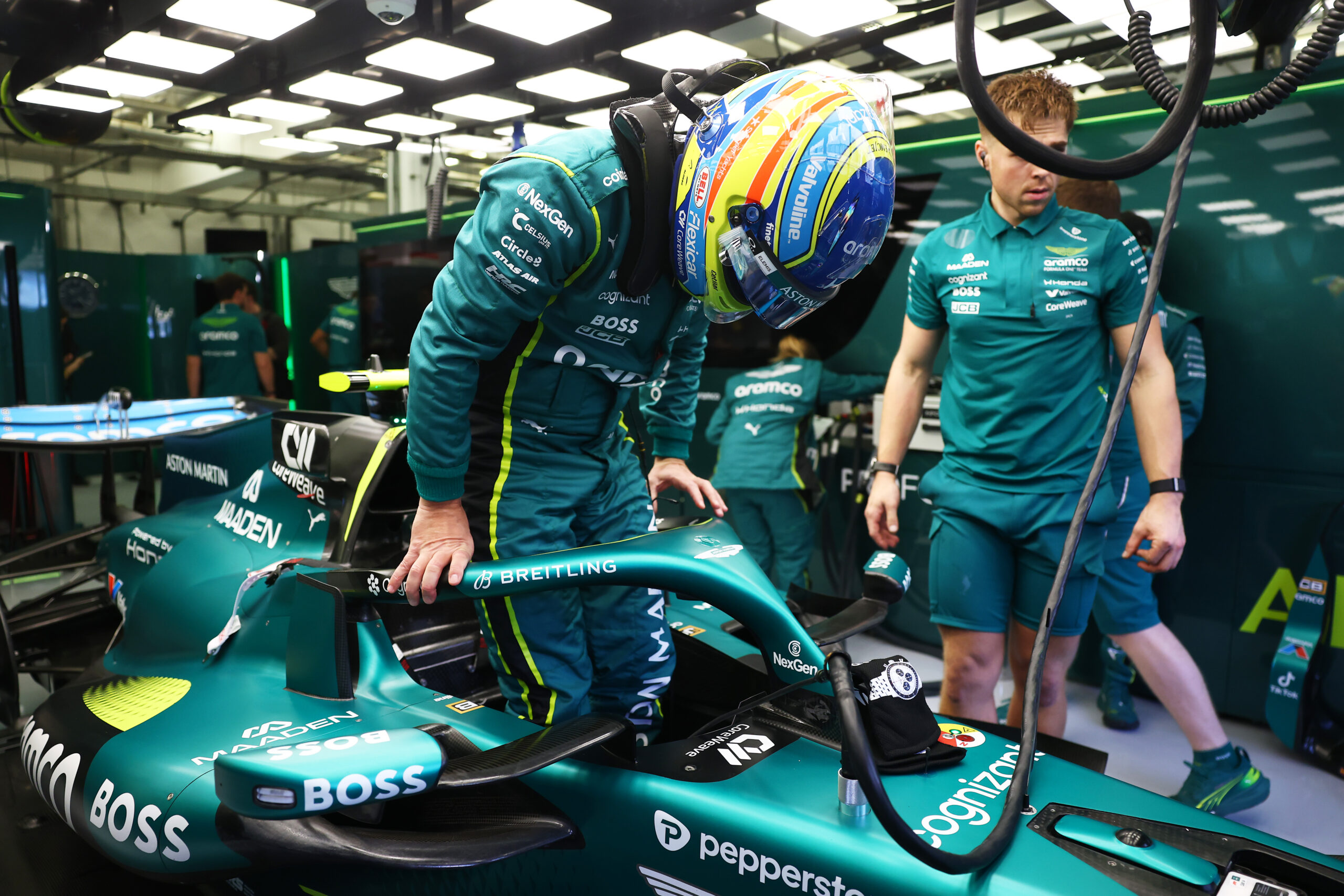 Fernando Alonso stepping into the AMR26 during Bahrain preseason testing.