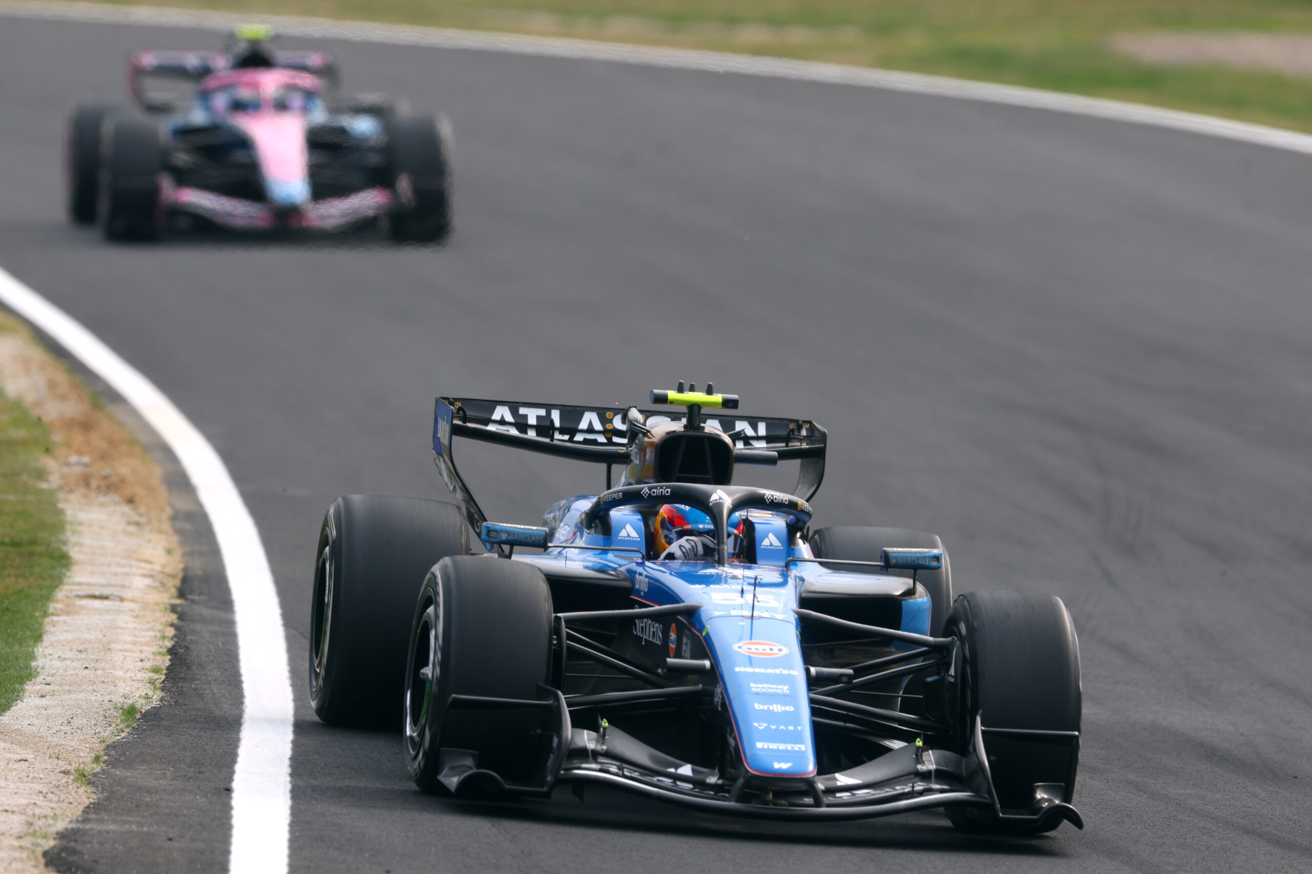 Williams' Carlos Sainz leads Alpine's Franco Colapinto at the 2026 F1 Japanese GP. He would start 16th and finish 15th.