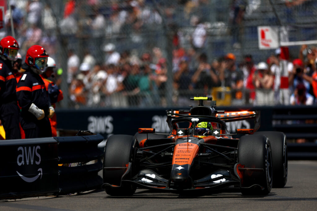 McLaren team members Lando Norris and Oscar Piastri speak at the 2026 F1 Monaco GP