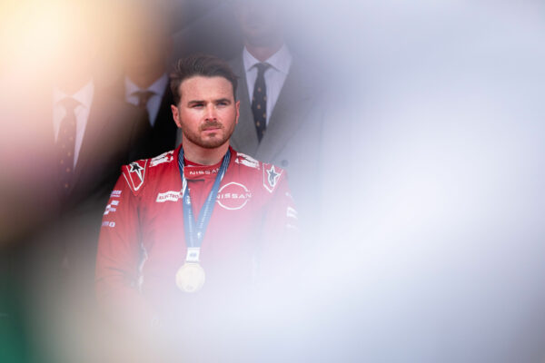 Nissan FE driver, Oliver Rowland on the top step of the Monaco E-Prix podium, after winning Race 1.
