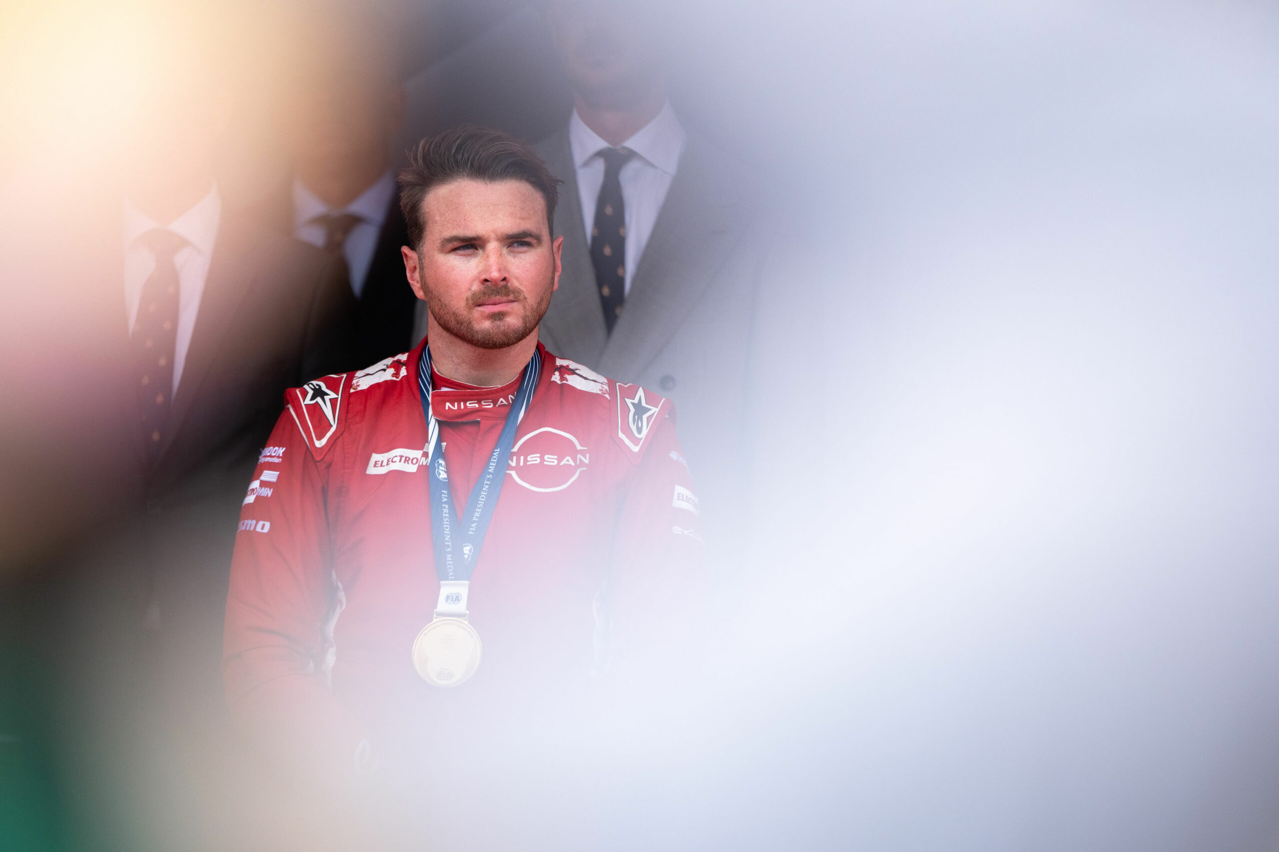 Nissan FE driver, Oliver Rowland on the top step of the Monaco E-Prix podium, after winning Race 1.