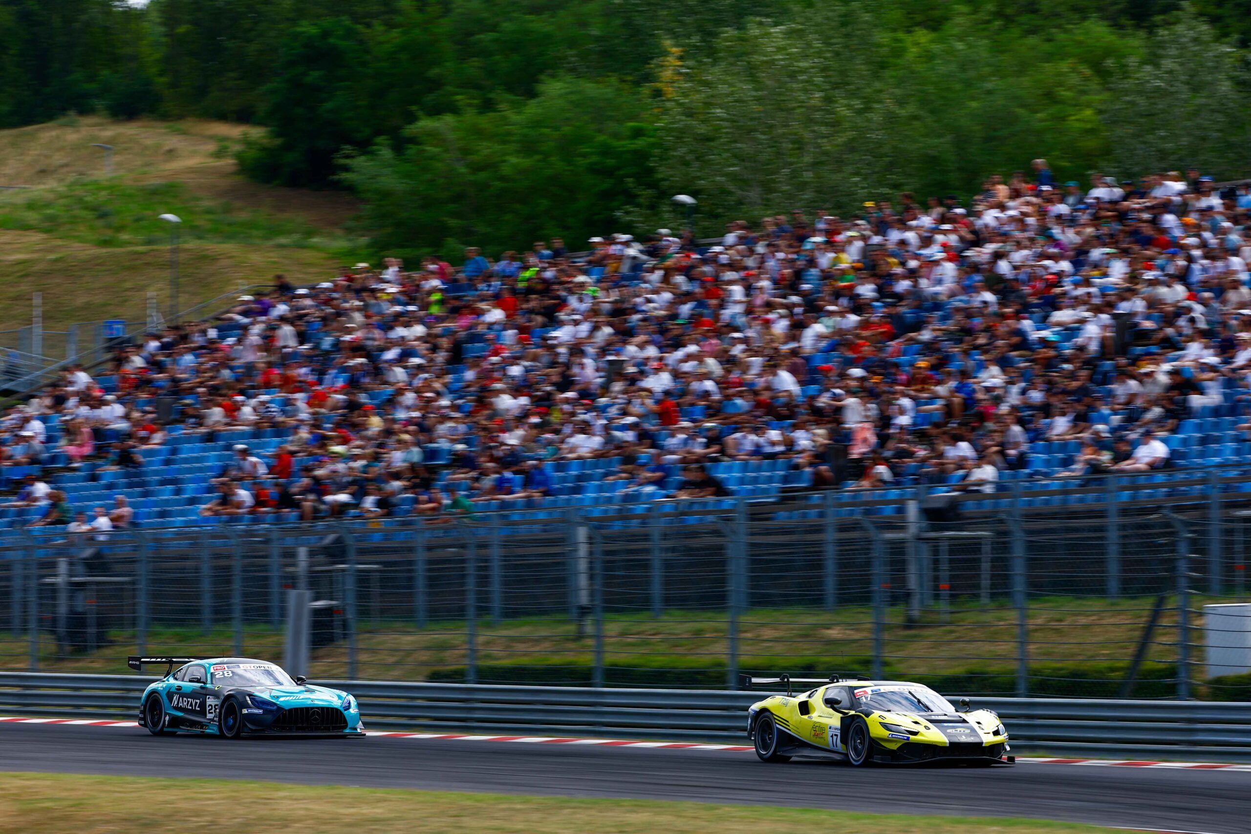 Emson and Lebbon retained the 2026 GT Open lead at Hungaroring after Race 2 victory, as Armanni and Fontana won Race 1.
