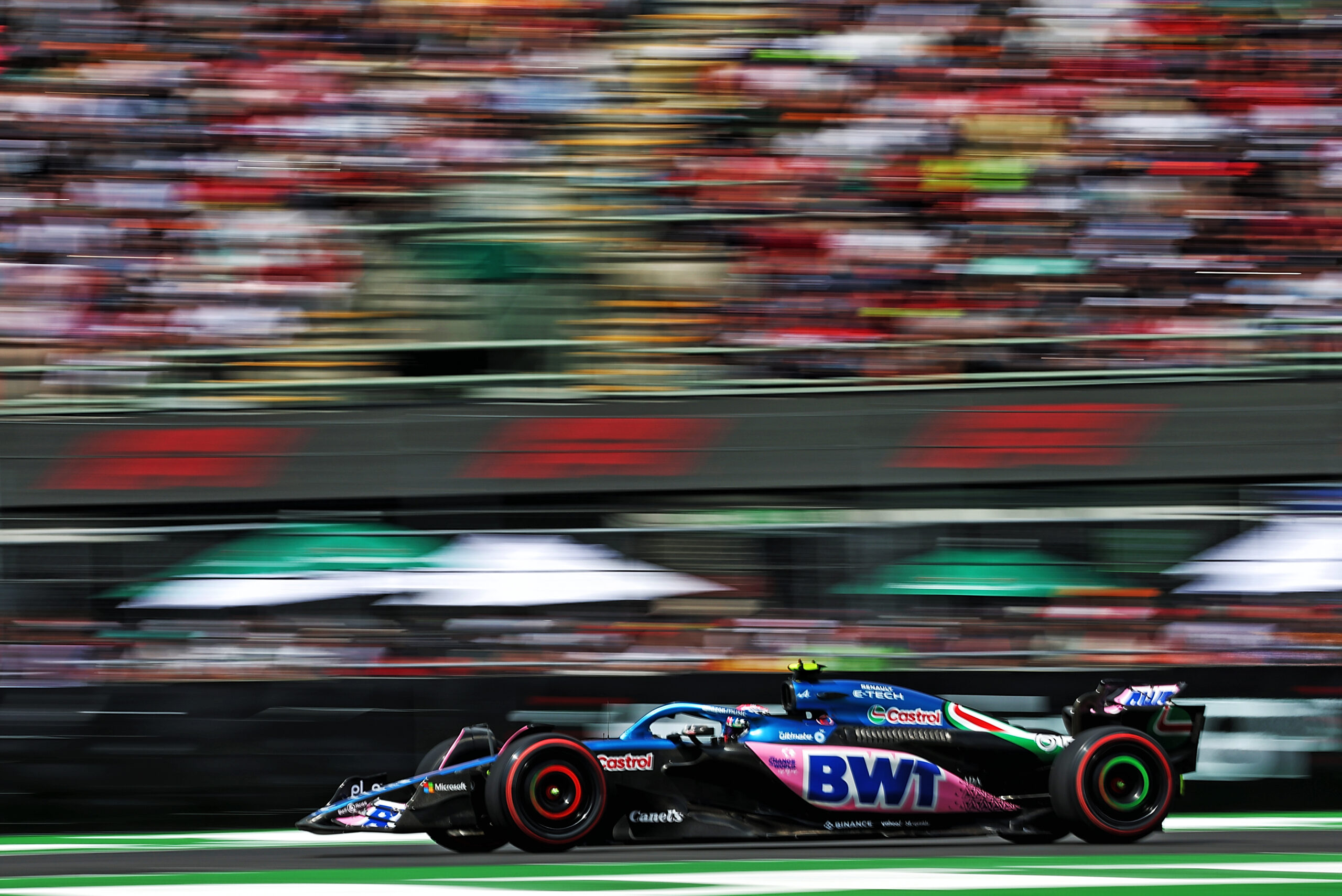 An Alpine being driven on the track