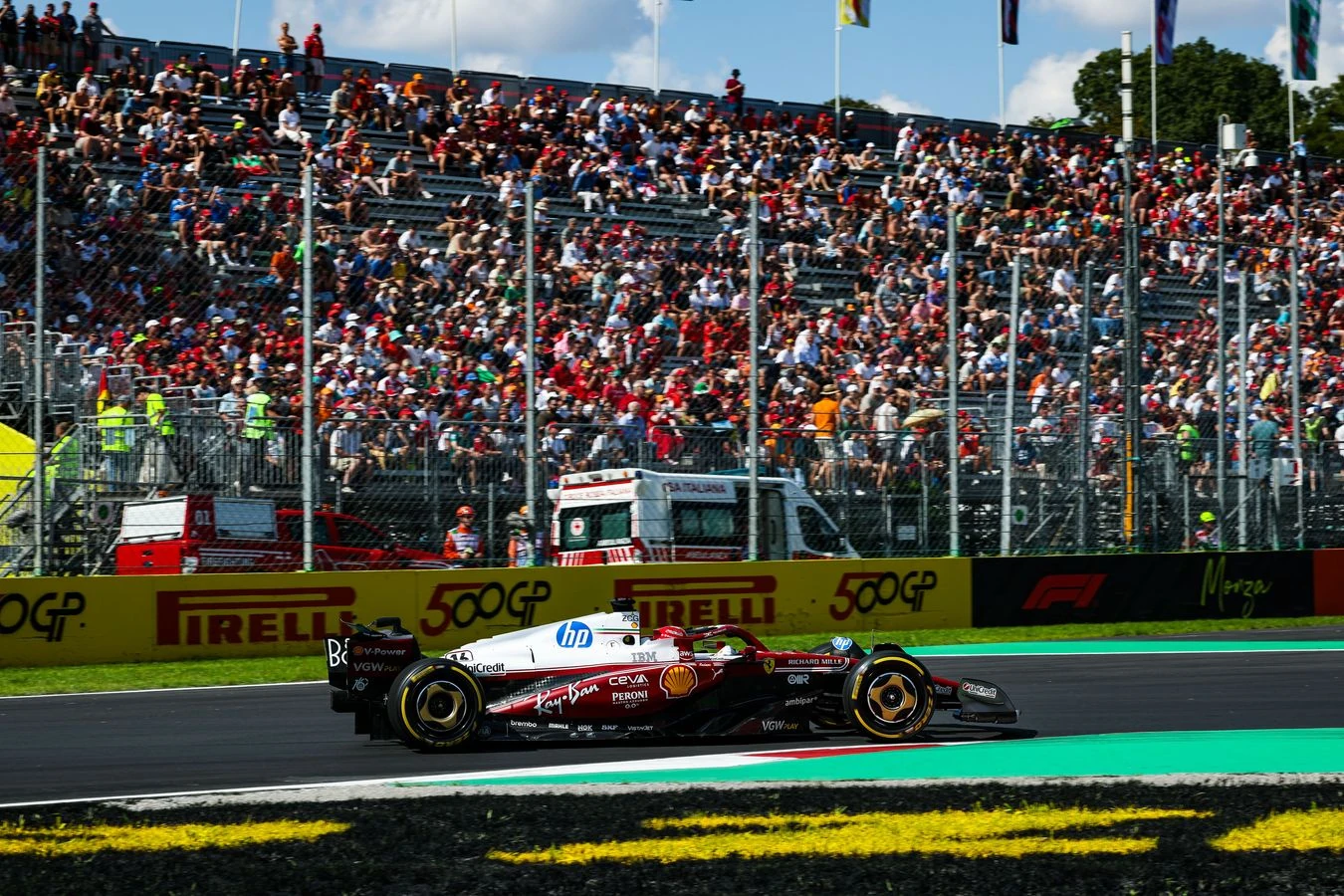 Charles Leclerc driving by Tifosi in Monza at the Italian GP