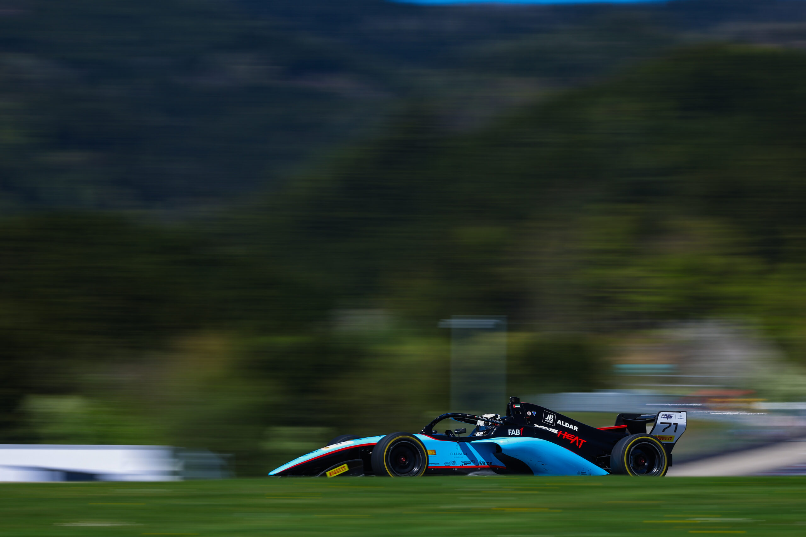 Al Dhaheri claims 2026 FREC Race 2 win at Spielberg after Gowda penalty, amid Safety Cars, fierce battles, and late drama.