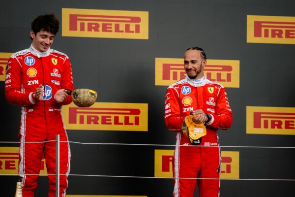 How have Scuderia Ferrari and drivers Lewis Hamilton and Charles Leclerc fared in Pit Debrief's mid-season F1 review in 2026?
