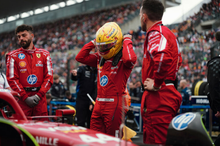 Lewis Hamilton gears up to get into his Ferrari ahead of Japanese GP