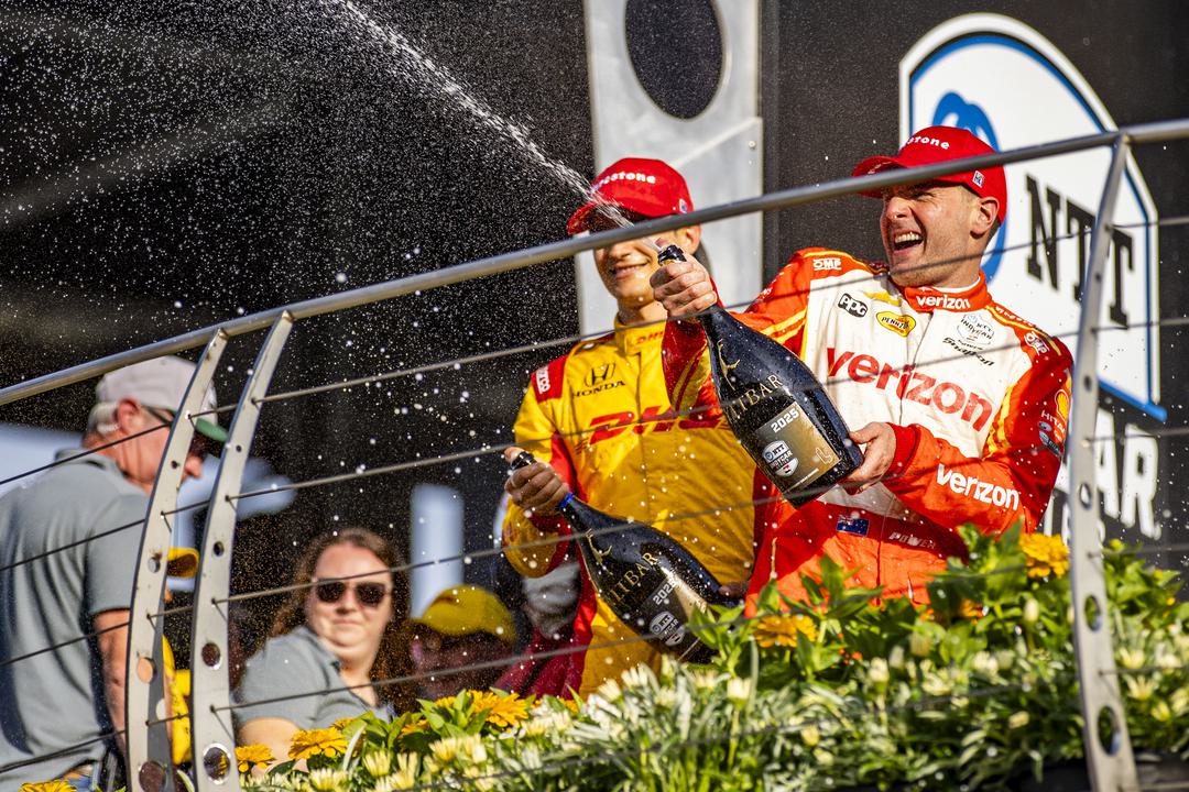 Will Power celebrating a podium finish with Alex Palou, during the IndyCar Sonsio GP.