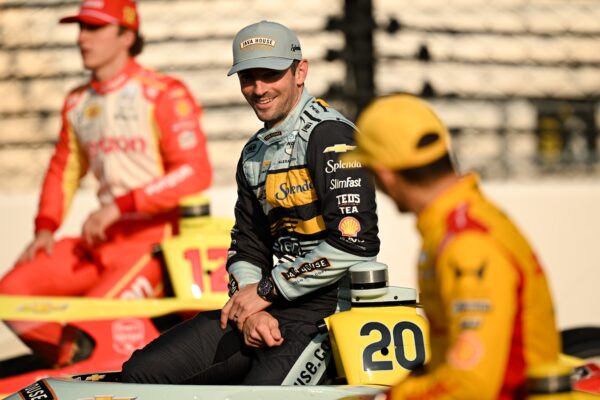 Alexander Rossi explained the unusual cause behind his Indy 500 practice crash, revealing that slow-speed pack running and dirty air in Turn 2 led to the heavy accident involving Pato O’Ward.