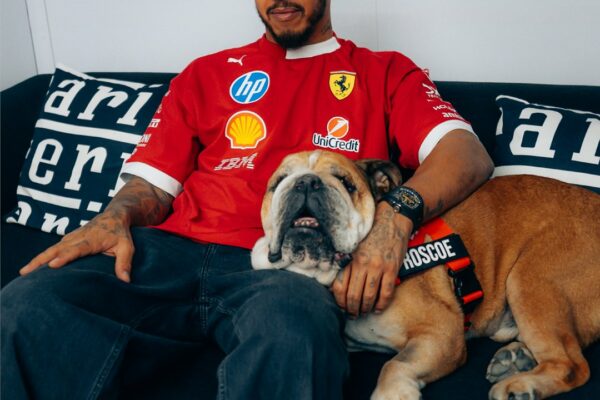 F1 driver for Ferrari Lewis Hamilton with dog Roscoe who passed away on Sunday