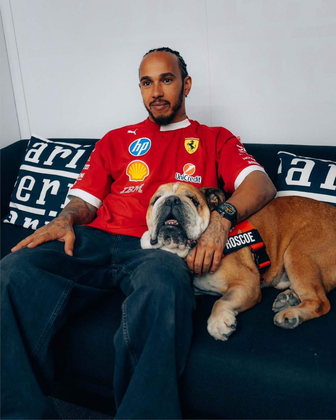 F1 driver for Ferrari Lewis Hamilton with dog Roscoe who passed away on Sunday