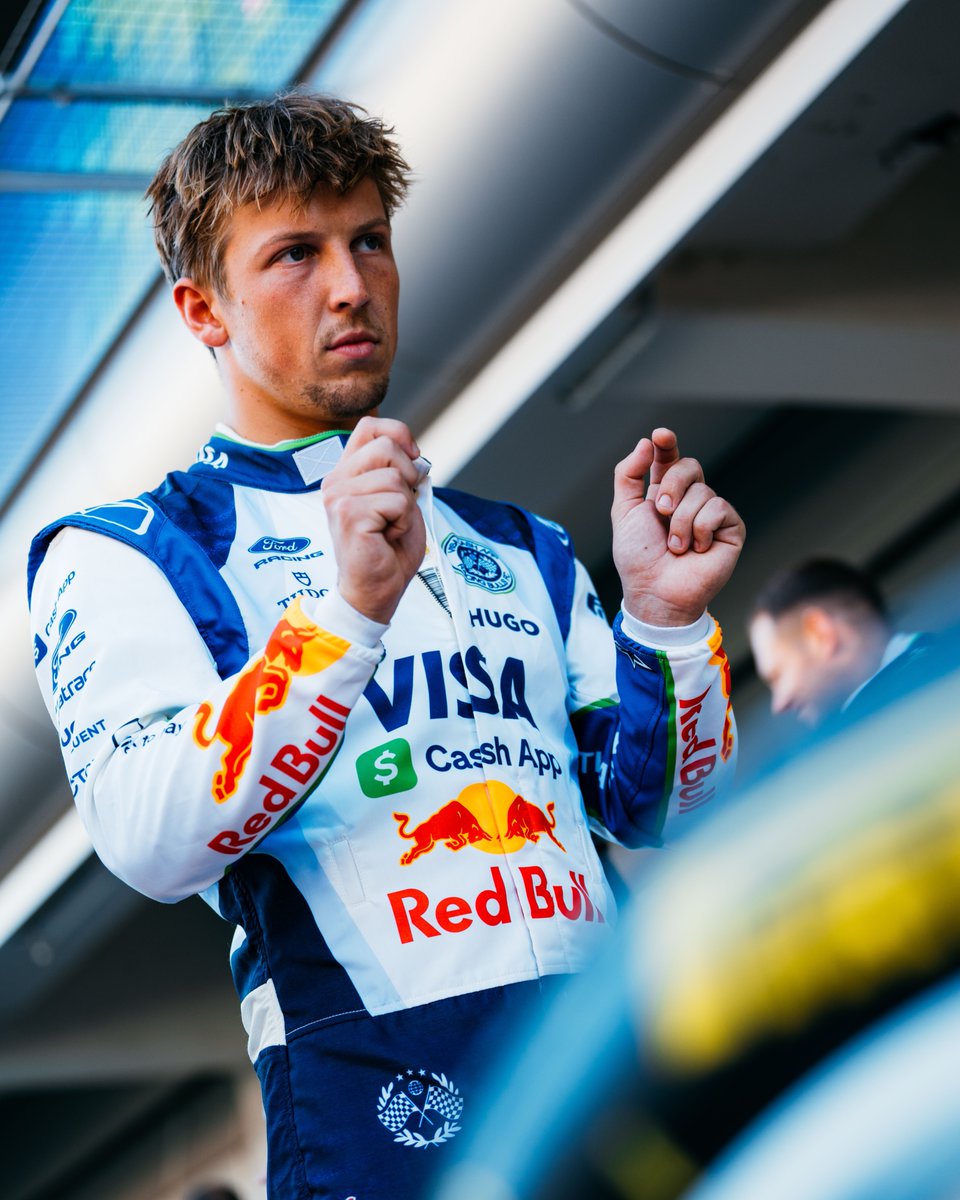 Liam Lawson, VCARB Formula 1 driver, pictured in the paddock during the 2026 F1 season, focused before a session.