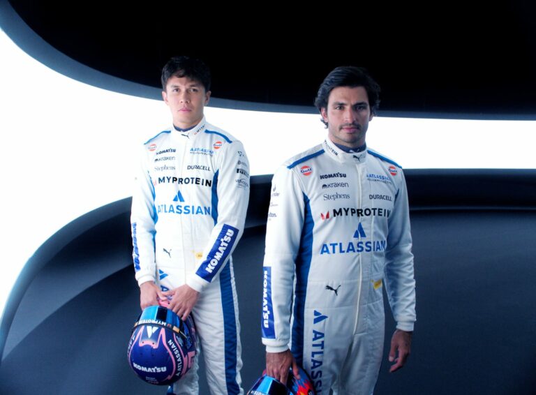 Williams Racing F1 agree multi-year deal with Atlassian. Carlos Sainz and Alex Albon pose for a photo.
