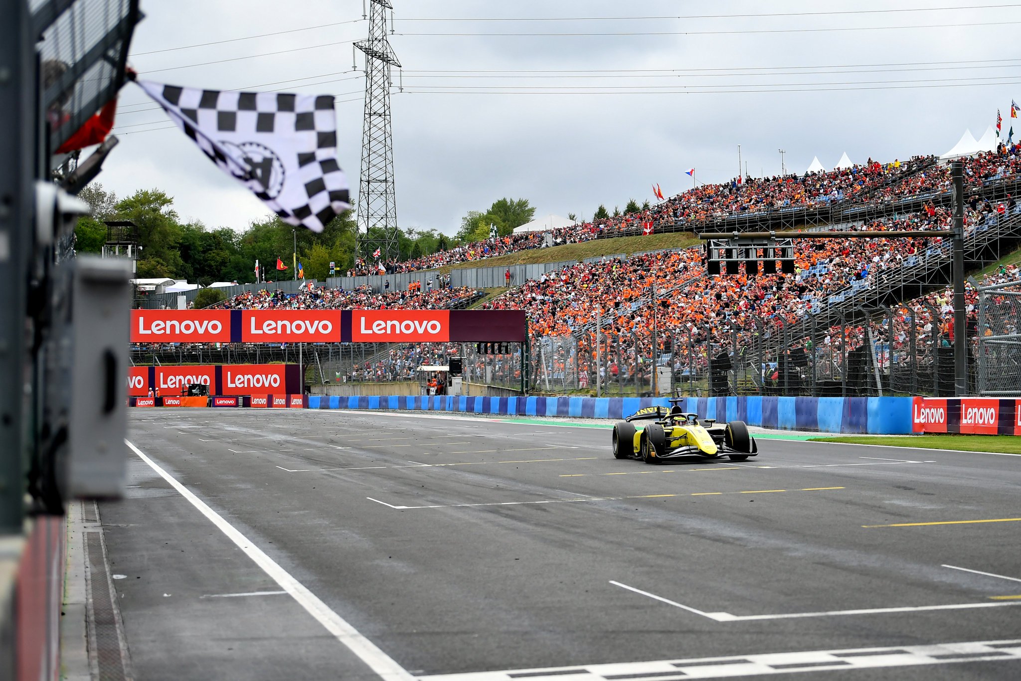 Invicta Racing's Leonardo Fornaroli crossing the line to win the Feature Race at the F2 Hungarian GP.