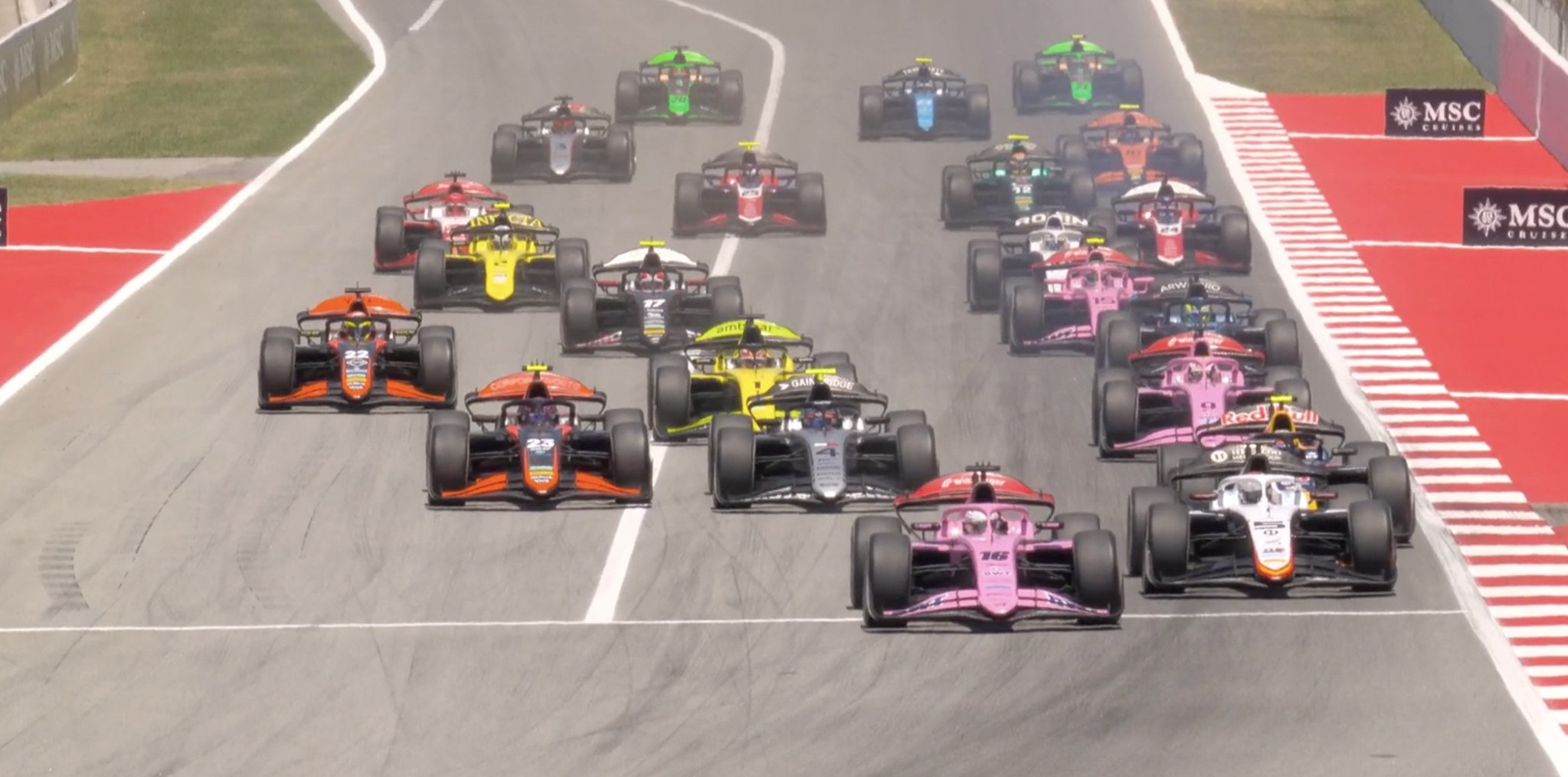 ART Grand Prix's Kush Maini leading the pack down to Turn 1 during the F2 Sprint Race at the 2026 Barcelona-Catalunya GP.