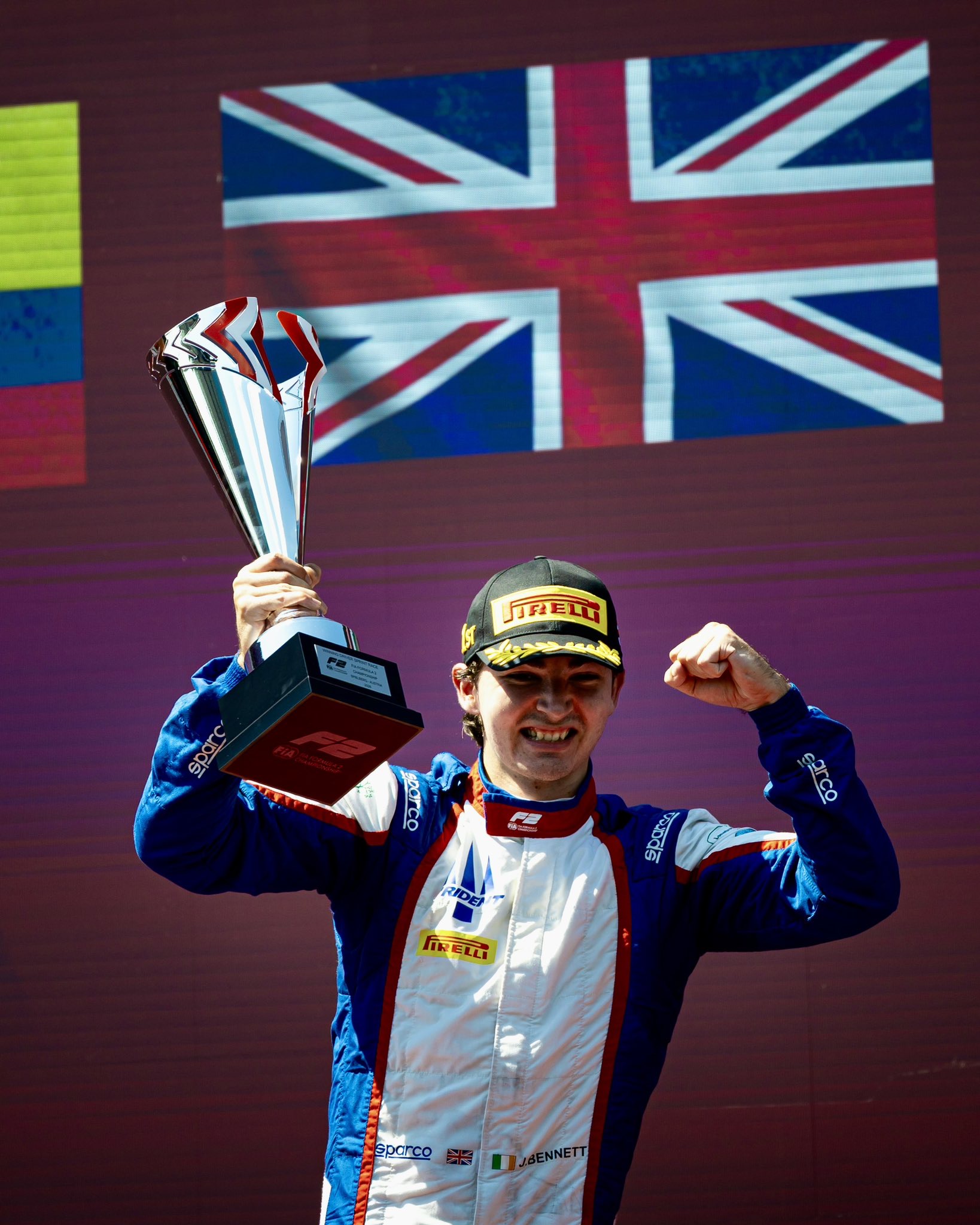 Trident's John Bennett on the podium after claiming his maiden F2 win during the Sprint Race at the 2026 Austrian GP.
