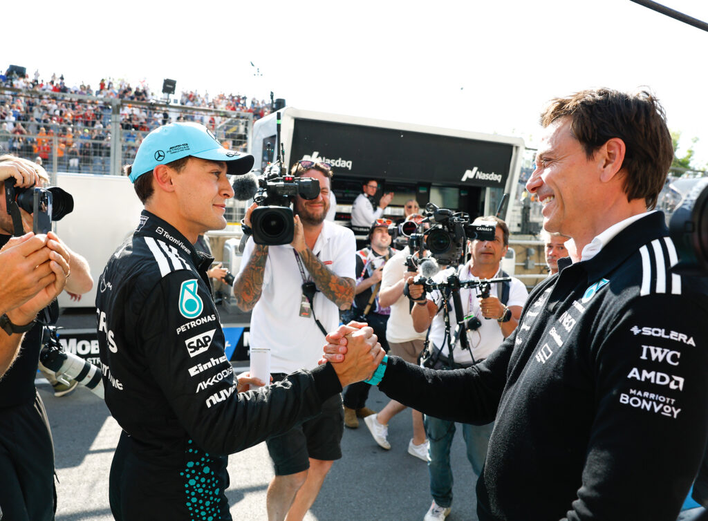 George Russell of Mercedes and Team Principal Toto Wolff