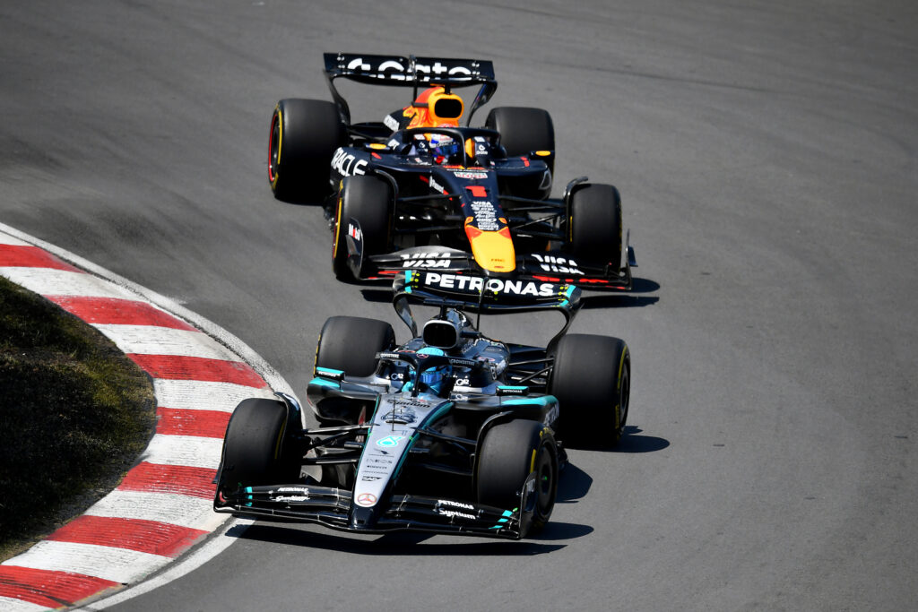 George Russell of Mercedes leads Max Verstappen of Red Bull at the 2025 F1 Canadian GP