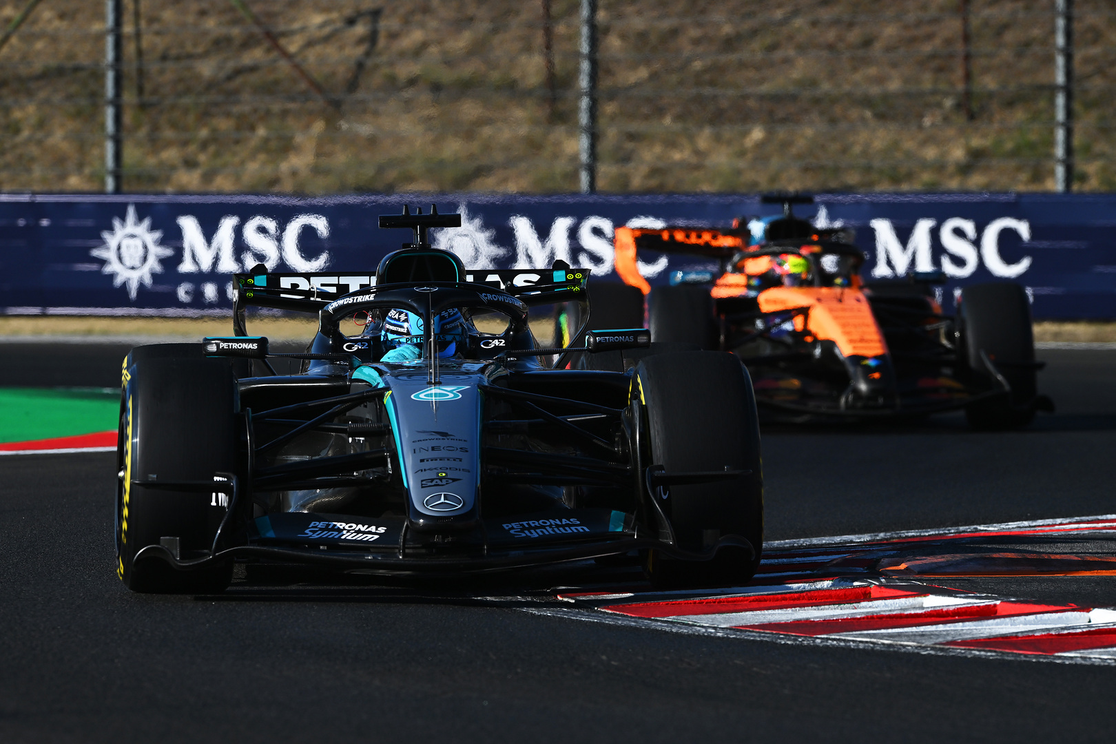Toto Wolff outlined Mercedes' strategic approach to upgrades at the 2026 F1 Hungarian GP, acknowledging McLaren's step forward while backing his team's second-half weighted development plan.
