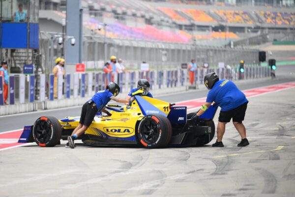 SHANGHAI, CHINA - MAY 31: Lola Yamaha ABT Formula E Team members push the number 11 car of Lucas di Grassi of Brazil and Lola Yamaha ABT Formula E Team in the Pitlane during qualifying, ahead of the Shanghai E-Prix, Round 10 of the 2025 FIA Formula E World Championship at Shanghai International Circuit on May 31, 2025 in Shanghai, China. Lucas di Grassi discussed the value of Formula E ahead of the Berlin Rookie Test.