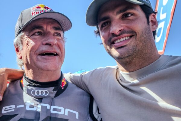Rally champion Carlos Sainz and F1 driver Carlos Sainz Jr at the finish line of Rally Dakar 2024