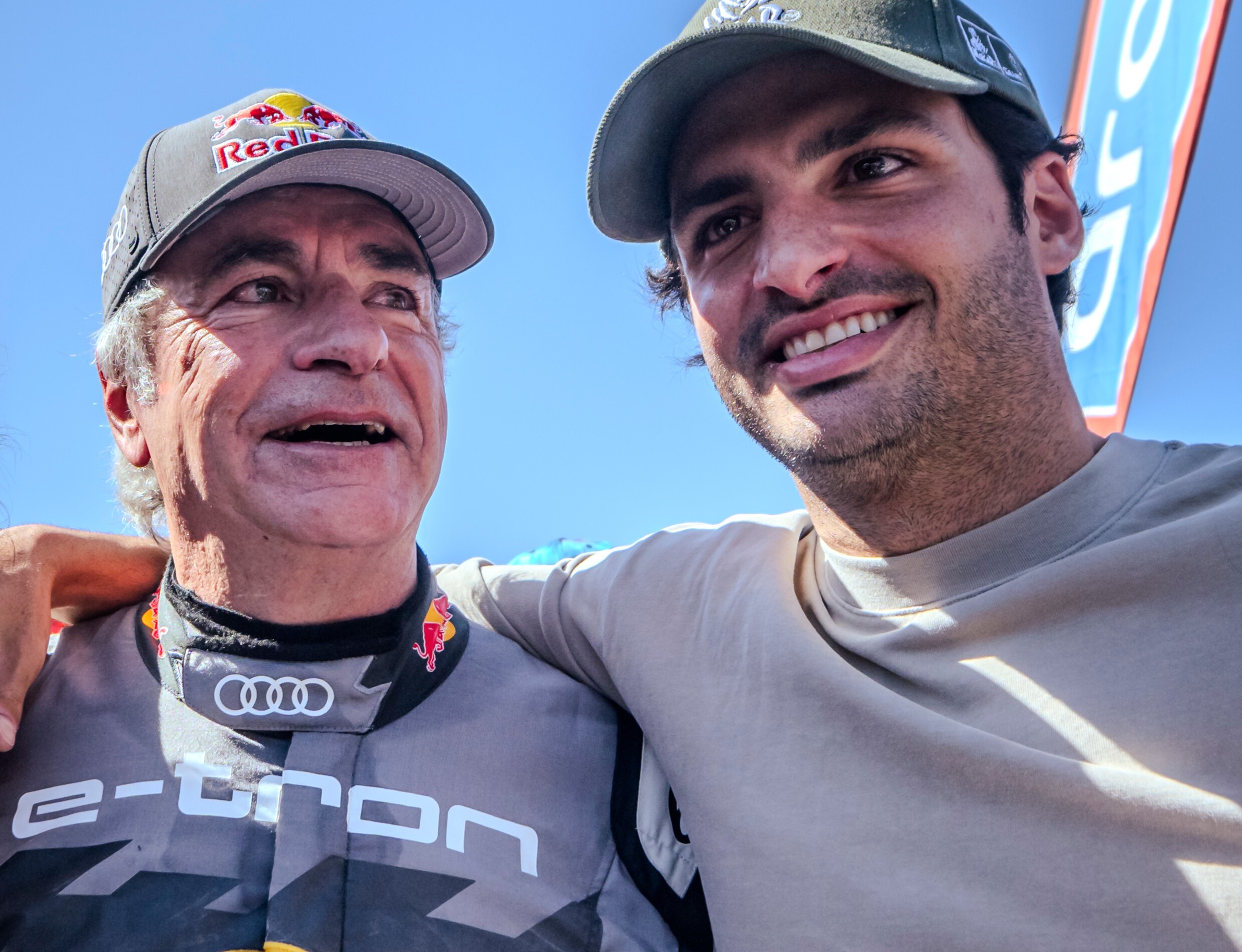 Rally champion Carlos Sainz and F1 driver Carlos Sainz Jr at the finish line of Rally Dakar 2024