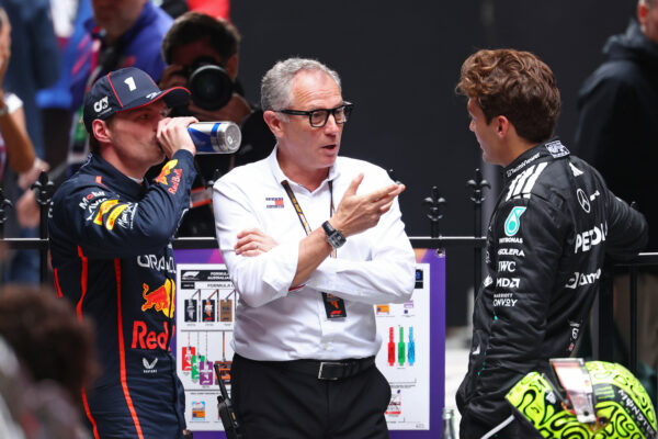 MELBOURNE, AUSTRALIA - MARCH 16: Second placed Max Verstappen of the Netherlands and Oracle Red Bull Racing Stefano Domenicali, CEO of the Formula One Group and Third placed George Russell of Great Britain and Mercedes AMG Petronas F1 Team talk in parc ferme during the F1 Grand Prix of Australia at Albert Park Grand Prix Circuit on March 16, 2025 in Melbourne, Australia. (Photo by Clive Rose/Getty Images) // Getty Images / Red Bull Content Pool // SI202503160115 // Usage for editorial use only //
