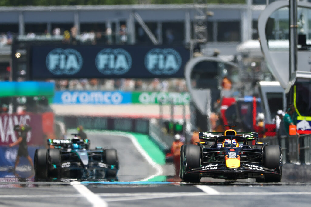 Max Verstappen of Red Bull Racing leads George Russell of Mercedes-AMG F1 at the Spanish Grand Prix