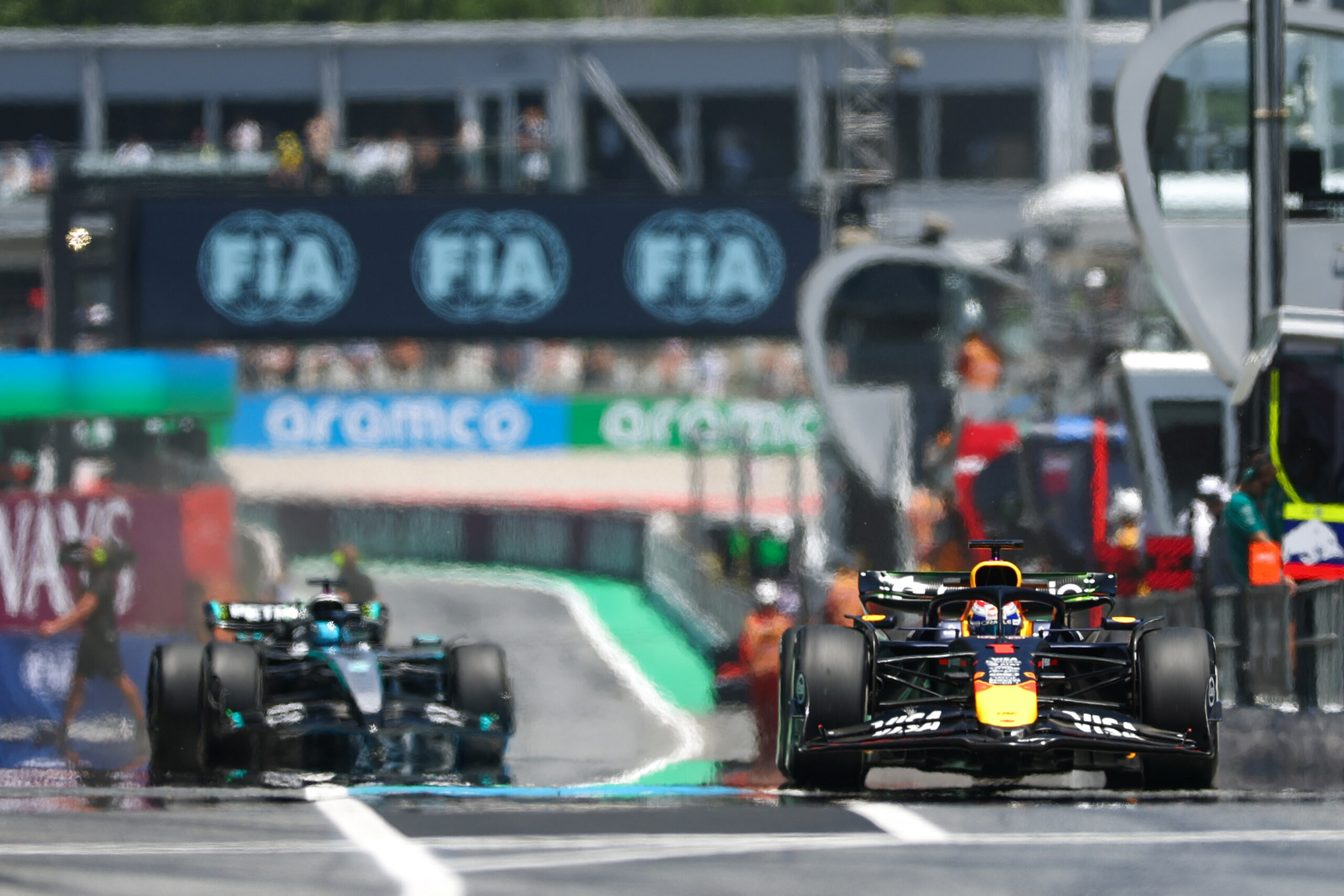 Max Verstappen of Red Bull Racing leads George Russell of Mercedes-AMG F1 at the Spanish Grand Prix