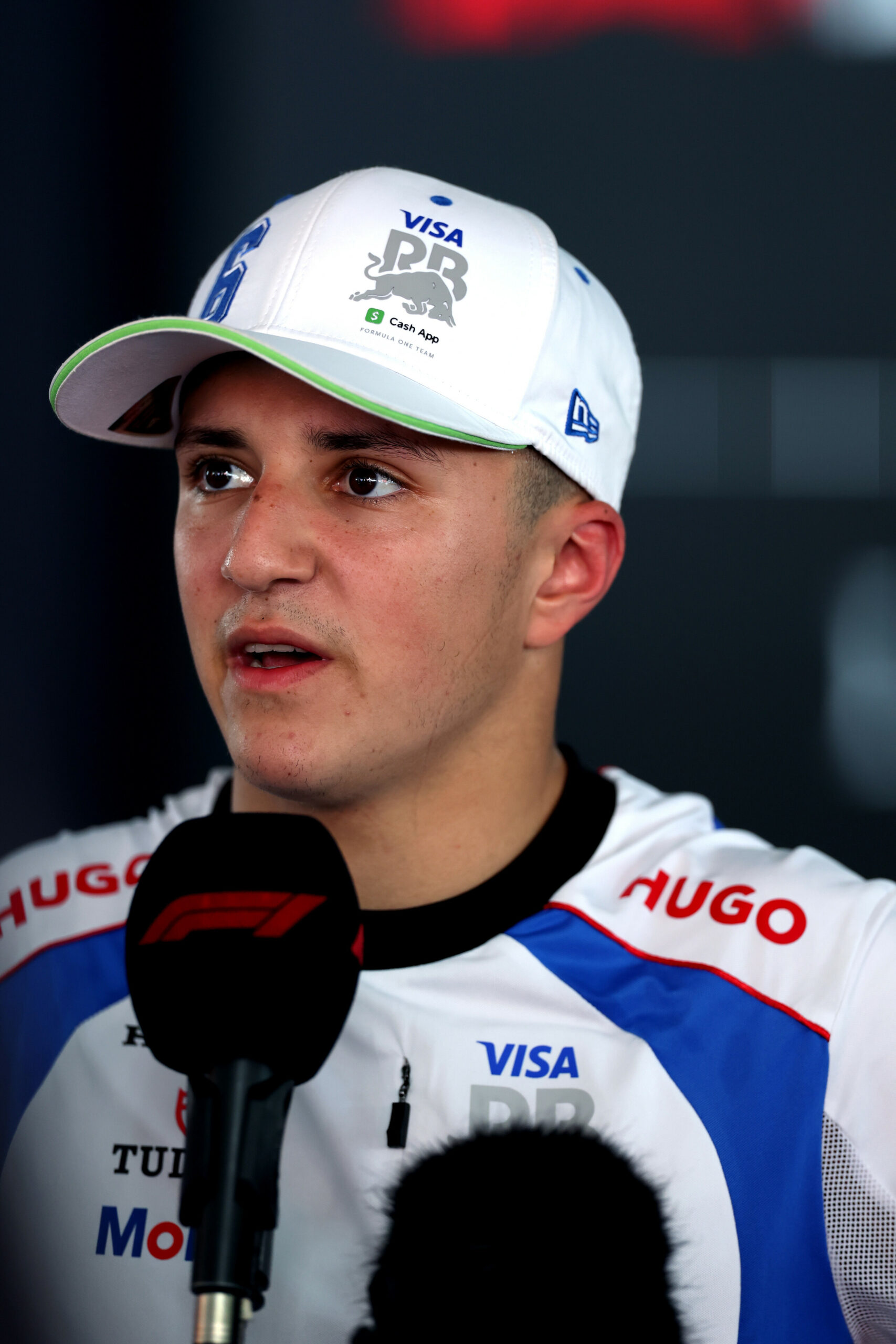 BARCELONA, SPAIN - JUNE 01: Seventh placed Isack Hadjar of France and Visa Cash App Racing Bulls is interviewed during the F1 Grand Prix of Spain at Circuit de Barcelona-Catalunya on June 01, 2025 in Barcelona, Spanish GP.