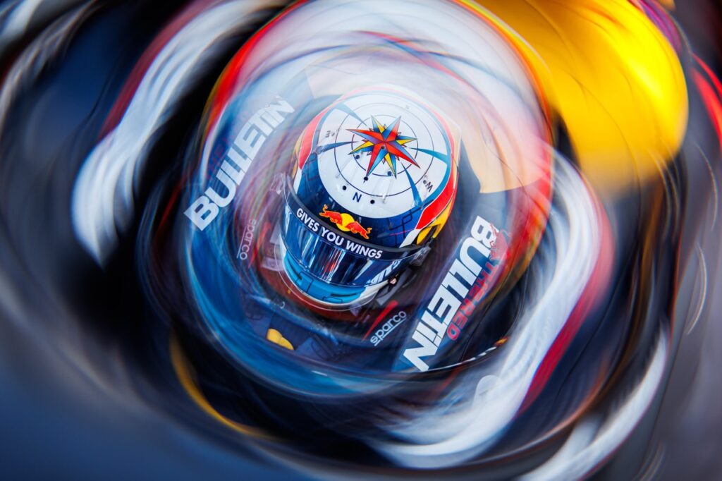 Pepe Martí from top, in his car showing the top of his helmet