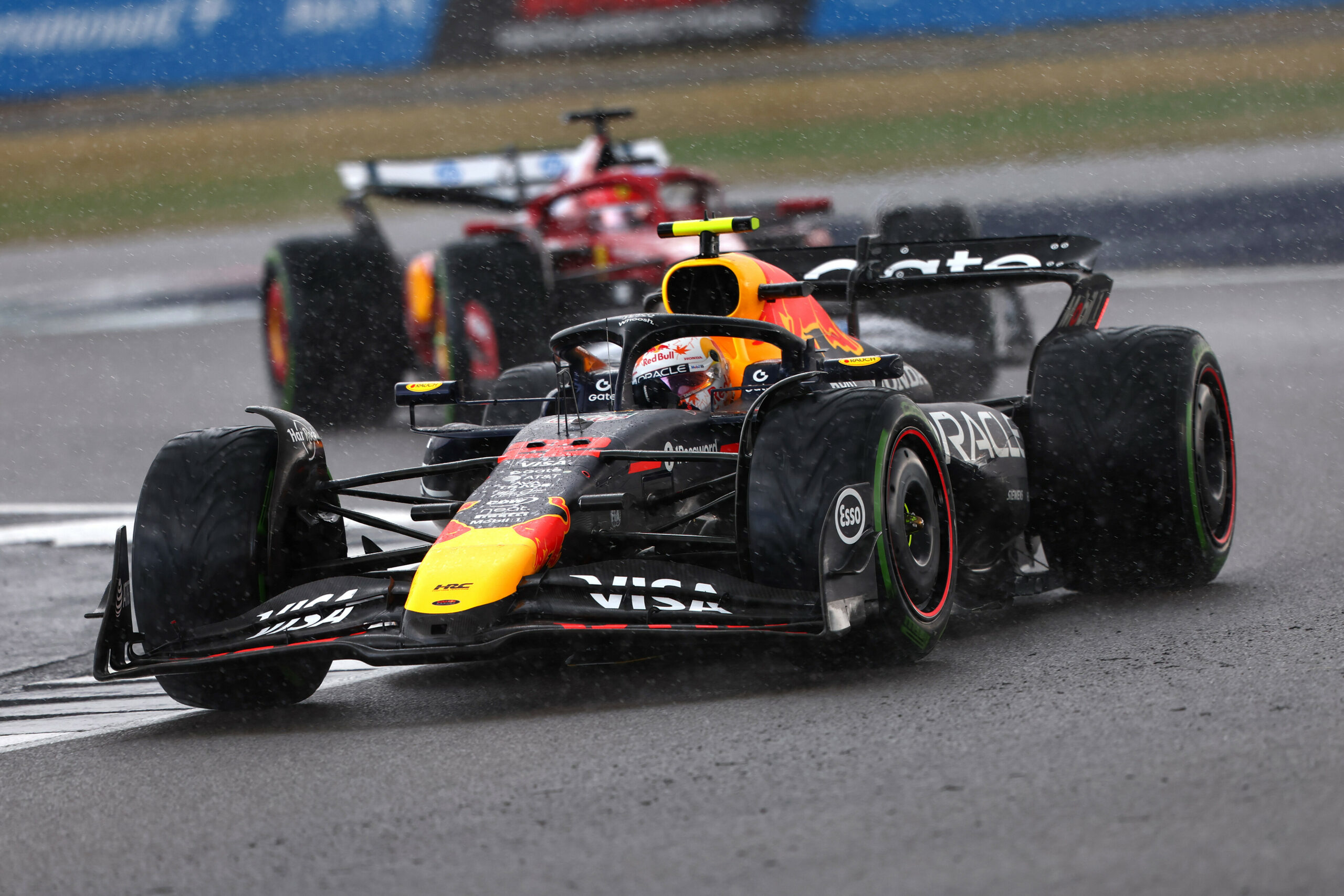 NORTHAMPTON, ENGLAND - JULY 06: Yuki Tsunoda of Japan driving the (22) Oracle Red Bull Racing RB21 leads Charles Leclerc of Monaco driving the (16) Scuderia Ferrari SF-25 on track during the F1 Grand Prix of Great Britain at Silverstone Circuit on July 06, 2025 in Northampton, England. (Photo by Andy Hone/LAT Images) // Getty Images / Red Bull Content Pool // SI202507060339 // Usage for editorial use only //