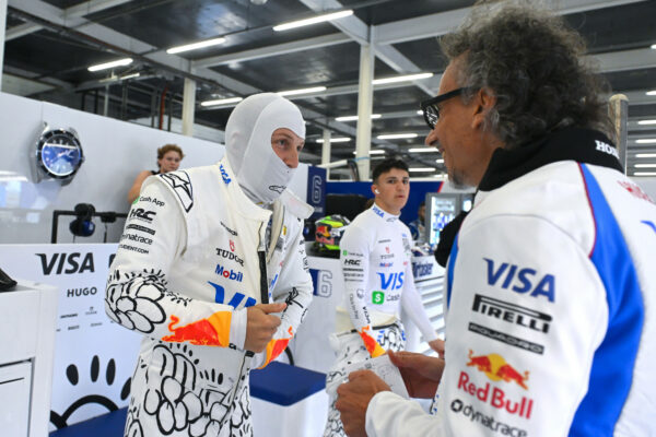 Racing Bulls drivers Liam Lawson and Isack Hadjar in the garage with team principal Laurent Mekies during the F1 British GP 2025