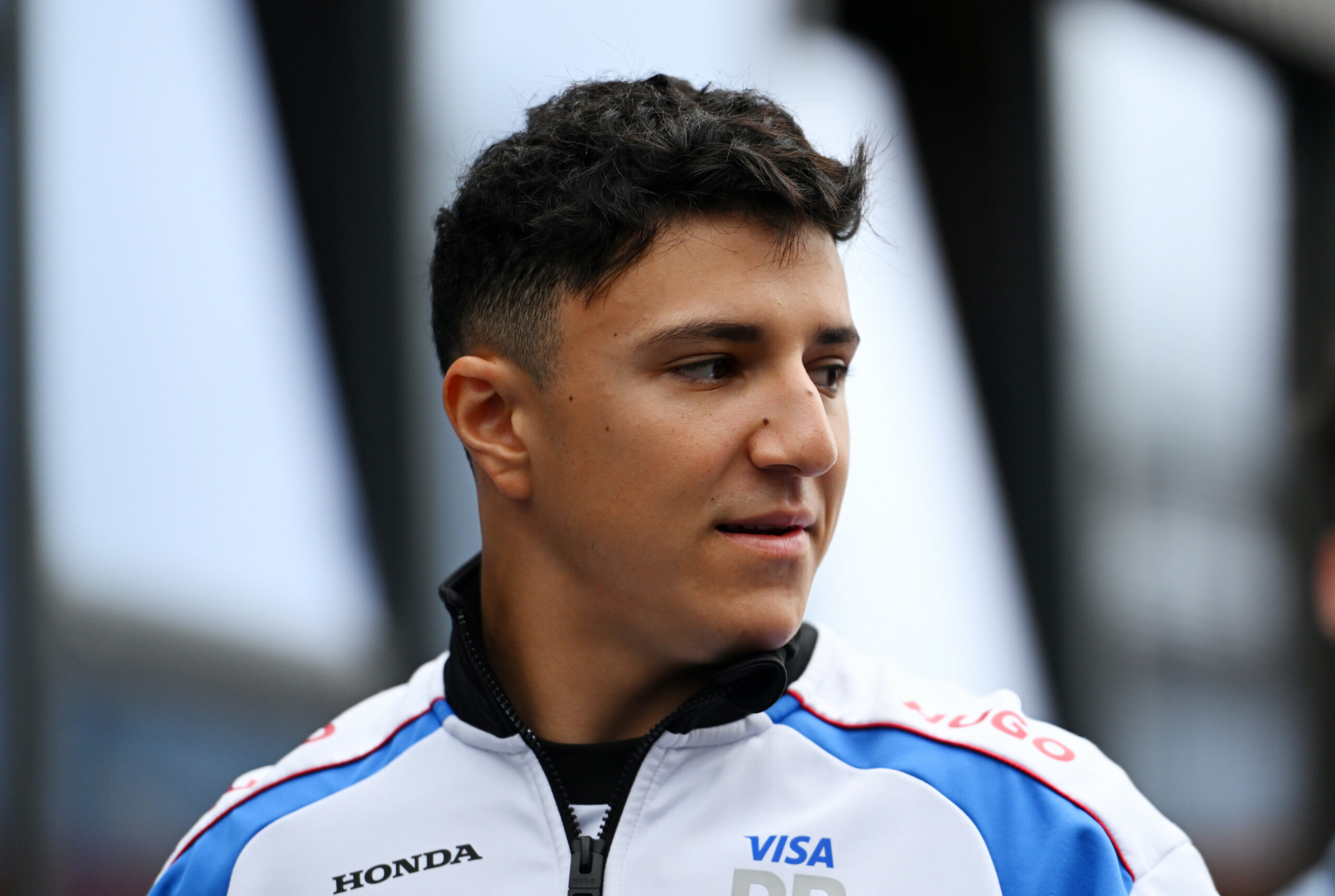 BUDAPEST, HUNGARY - AUGUST 03: Isack Hadjar of France and Visa Cash App Racing Bulls arrives in the Paddock prior to the F1 Grand Prix of Hungary at Hungaroring on August 03, 2025 in Budapest, Hungary. (Photo by Rudy Carezzevoli/Getty Images) // Getty Images / Red Bull Content Pool // SI202508030244 // Usage for editorial use only //