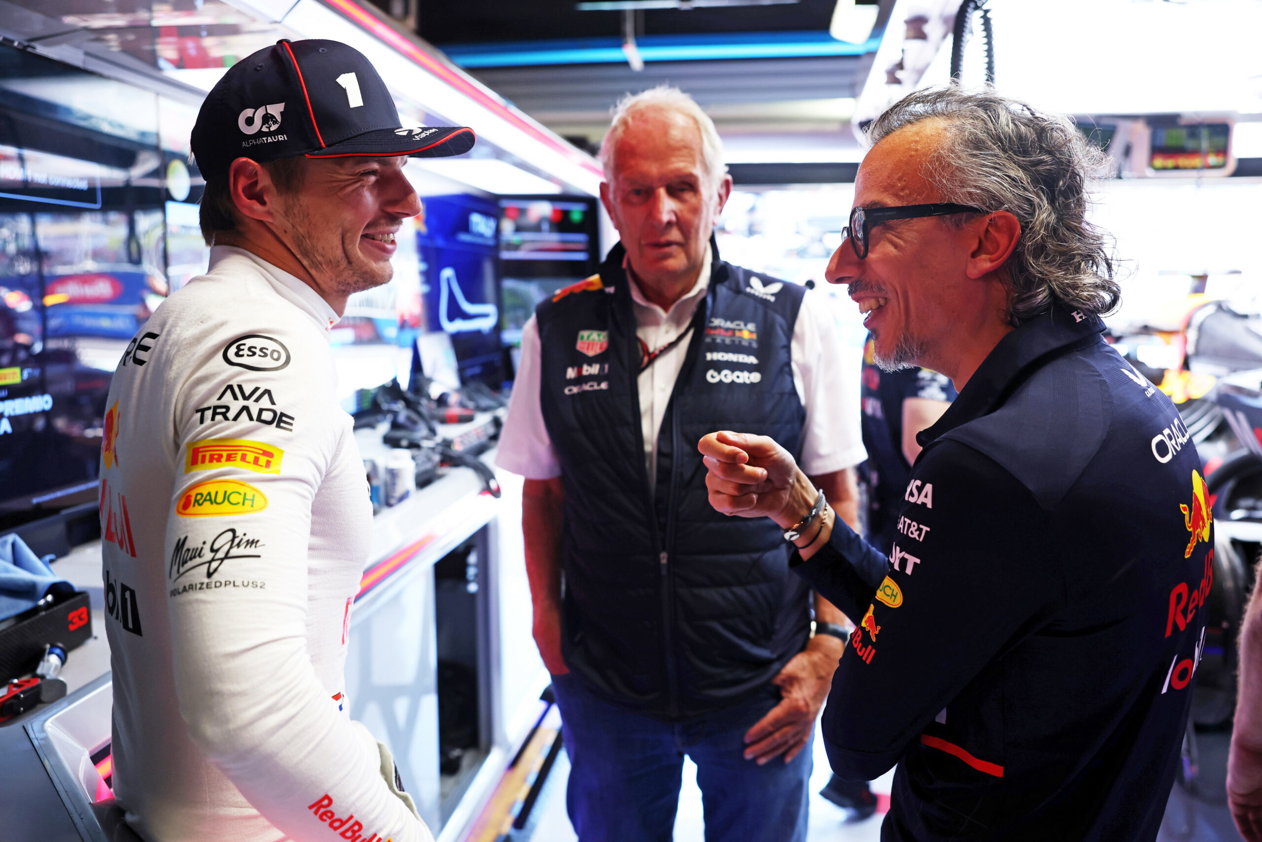 (L-R) Max Verstappen, Helmut Marko, and Laurent Mekies talking at the 2025 F1 Italian GP