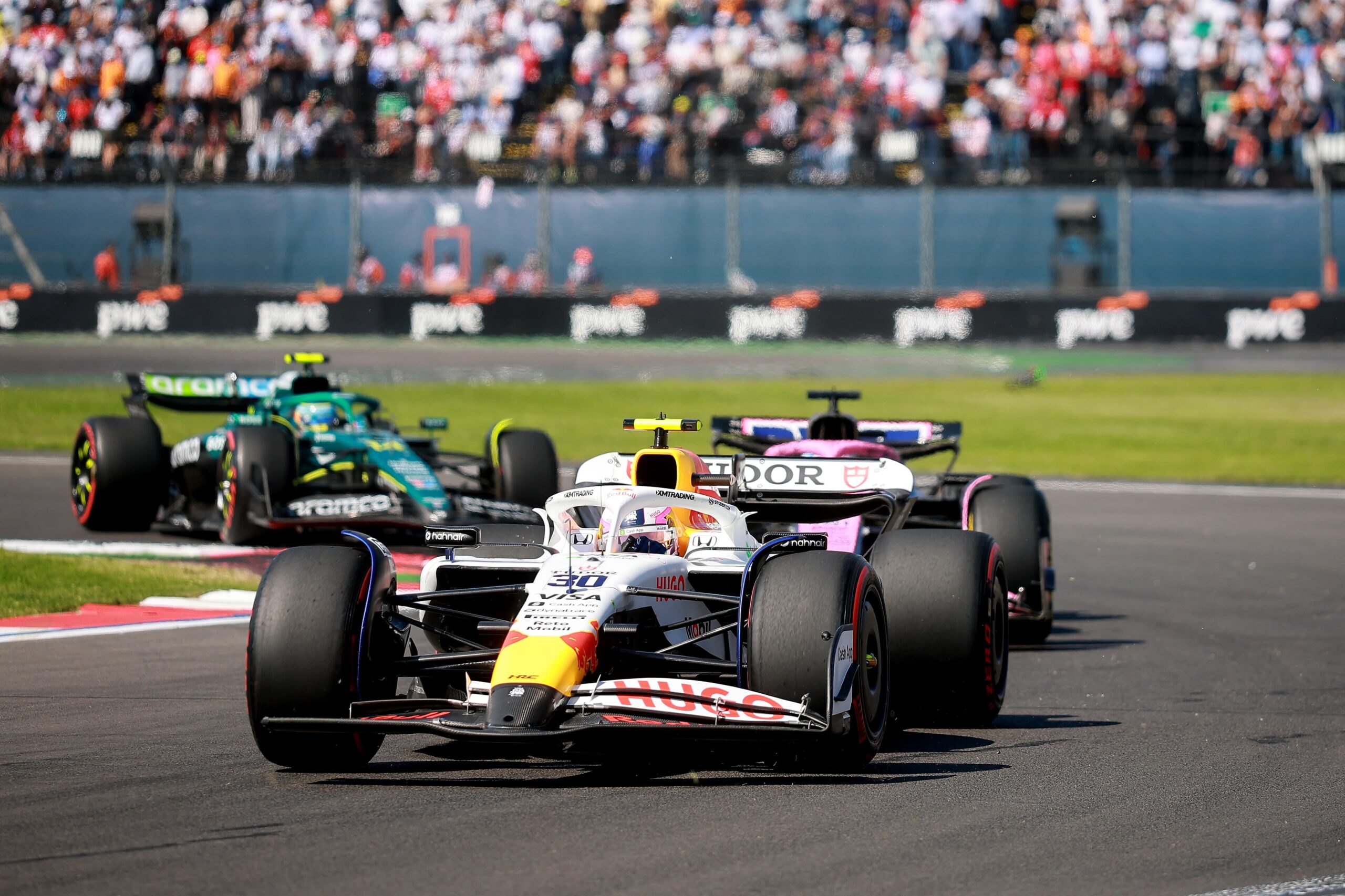 Lawson sporting a damaged front wing following turn 1 incident with Sainz at the 2025 F1 Mexico City GP, shortly before his close call with marshalls on track