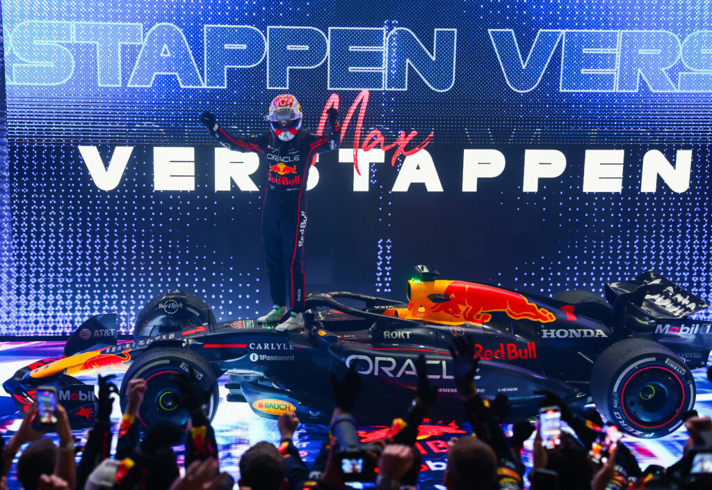 Red Bull Racing's Max Verstappen celebrating his win at the 2025 F1 Qatar GP amid three-way title battle.