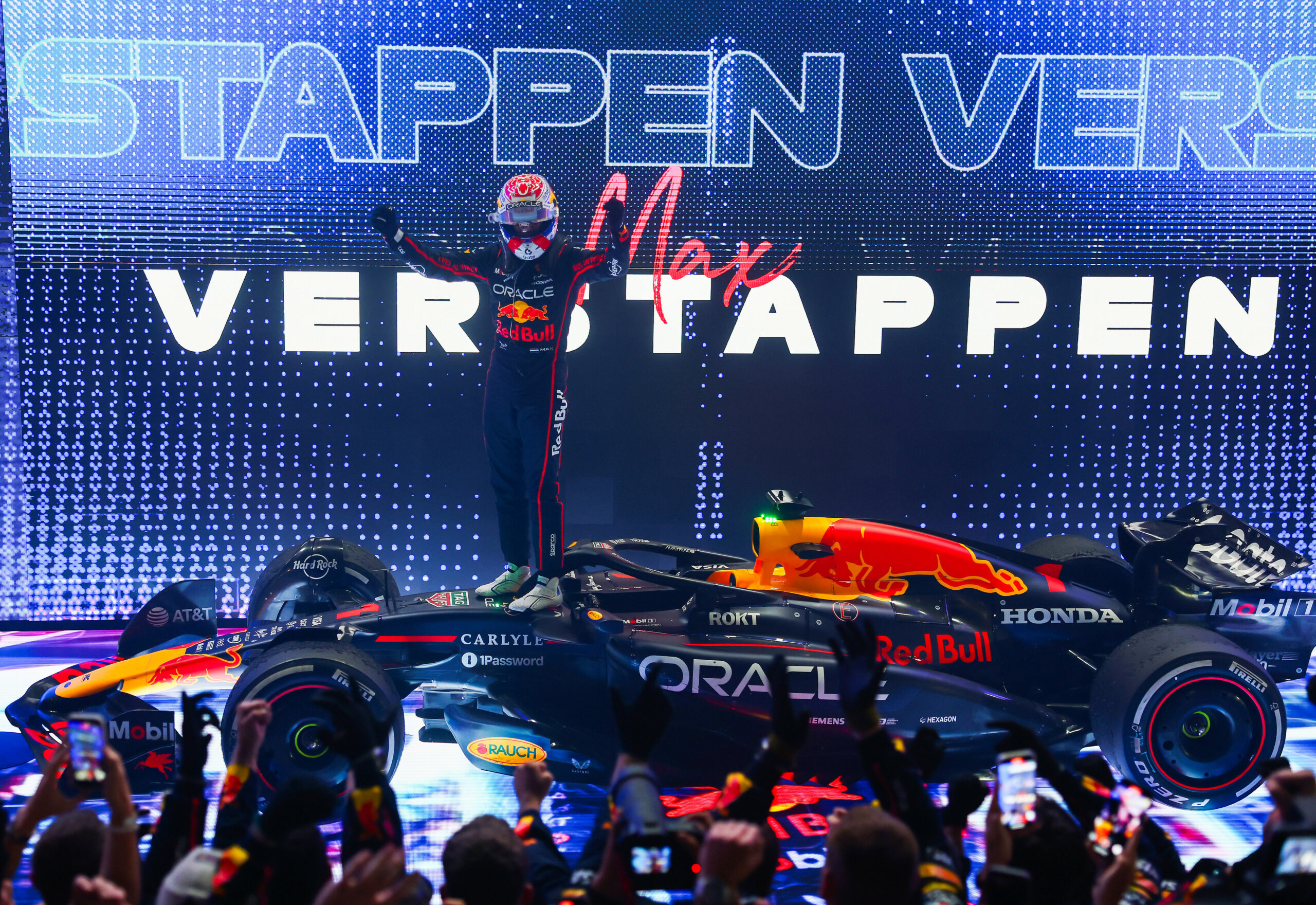 Red Bull Racing's Max Verstappen celebrating his win at the 2025 F1 Qatar GP amid three-way title battle.