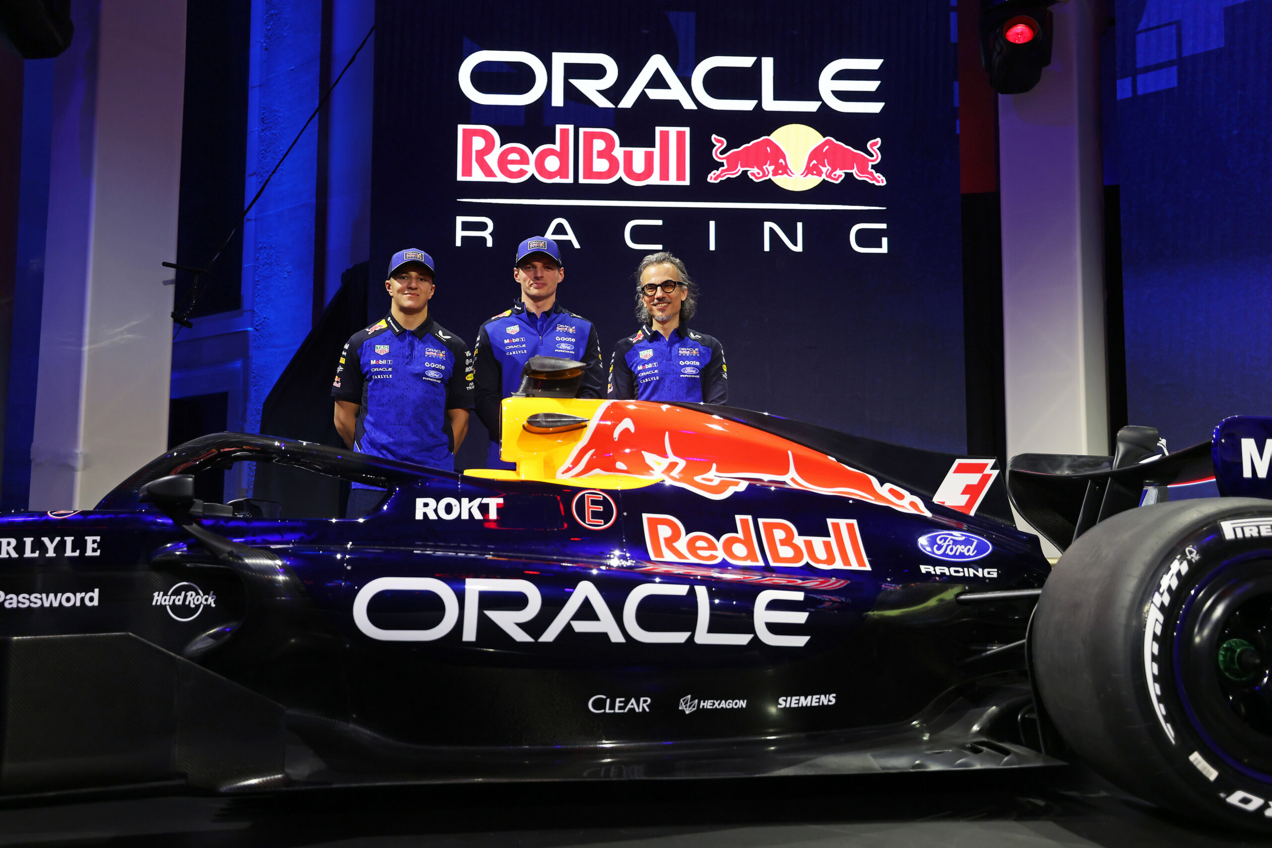 Red Bull Racing's Max Verstappen, Isack Hadjar and Laurent Mekies at the team's 2026 F1 livery reveal event.