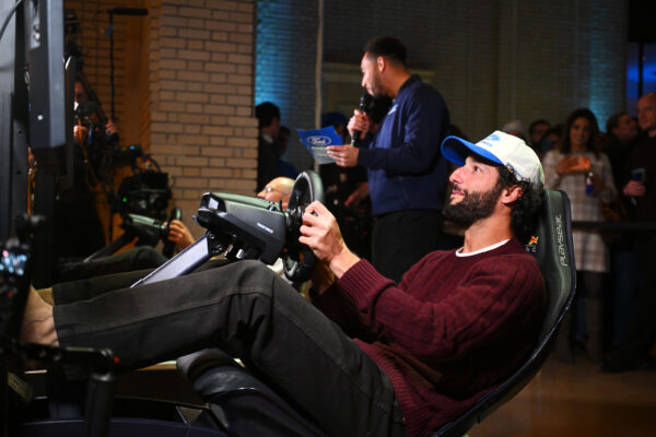Daniel Ricciardo plays on a Red Bull simulator ahead of the 2026 F1 season