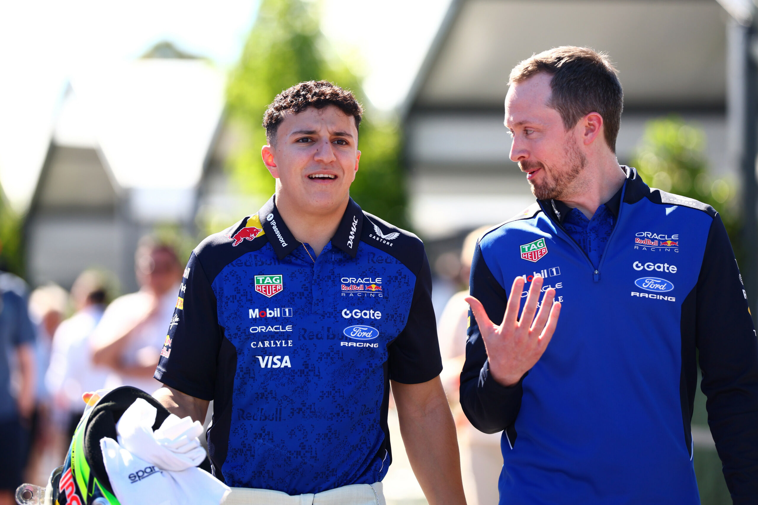 MELBOURNE, AUSTRALIA - MARCH 05: Isack Hadjar of France and Oracle Red Bull Racing and Richard Wood, Race Engineer of Oracle Red Bull Racing walk in the Paddock during previews ahead of the F1 Grand Prix of Australia at Albert Park Grand Prix Circuit on March 05, 2026 in Melbourne, Australia. (Photo by Joe Portlock/Getty Images) // Getty Images / Red Bull Content Pool