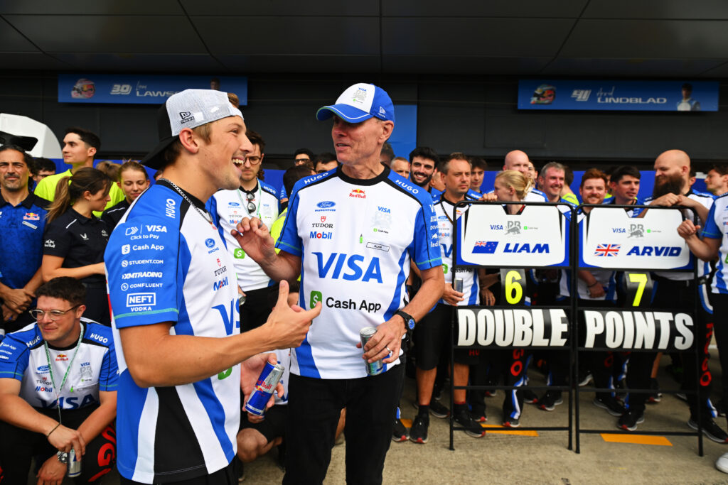 NORTHAMPTON, ENGLAND - JULY 05: Liam Lawson of New Zealand and Visa Cash App Racing Bulls Alan Permane, Team Principal of Visa Cash App Racing Bulls and the Visa Cash App Racing Bulls team celebrate during the F1 Grand Prix of Great Britain at Silverstone Circuit on July 05, 2026 in Northampton, England. (Photo by Rudy Carezzevoli/Getty Images) // Getty Images / Red Bull Content Pool // SI202607050528 // Usage for editorial use only //